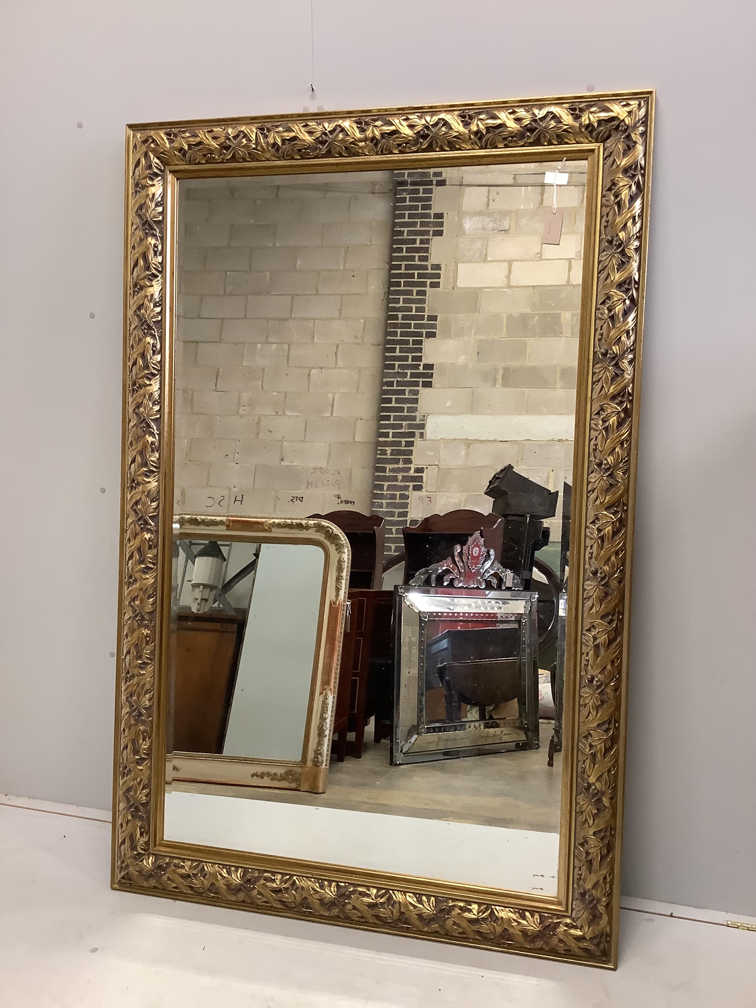 A large Victorian style rectangular gilt composition wall mirror, width 114cm, height 176cm                                                                                                                                 