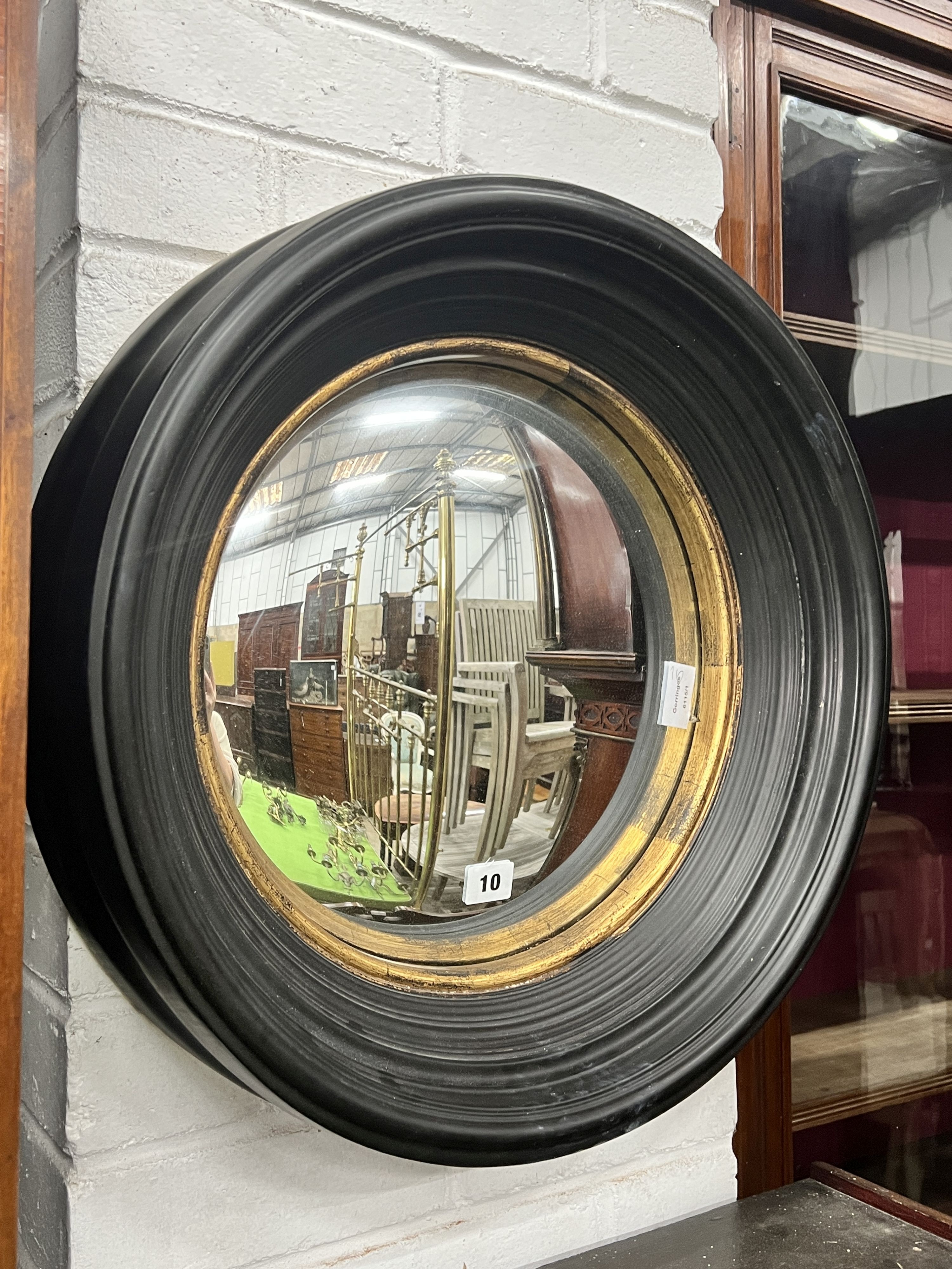 A contemporary parcel gilt convex wall mirror, diameter 50cm                                                                                                                                                                