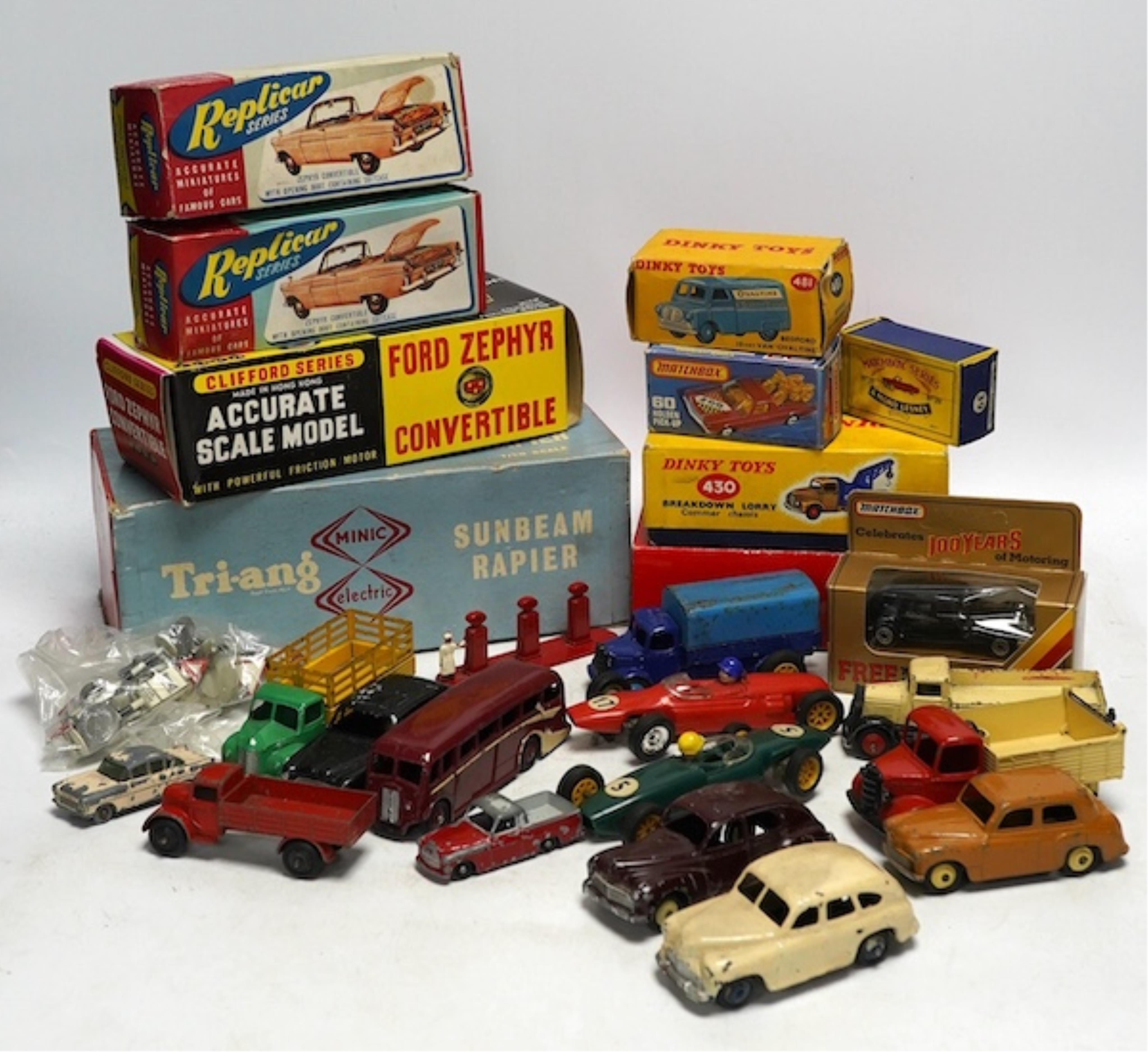 A quantity of diecast vehicles and a few useful boxes including; a boxed Clifford Series Ford Zephyr convertible, two boxed Replicar series Ford Zephyr convertibles, ten unboxed Dinky Toys, two Scalextric Formula One car