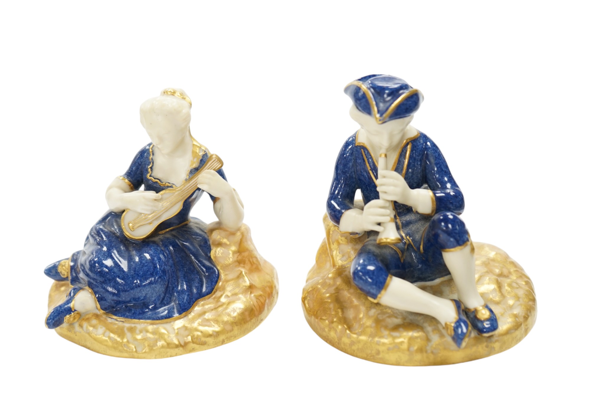 A pair of Worcester seated musicians, 1919, tallest 9.5cm. Condition - fair to good                                                                                                                                         