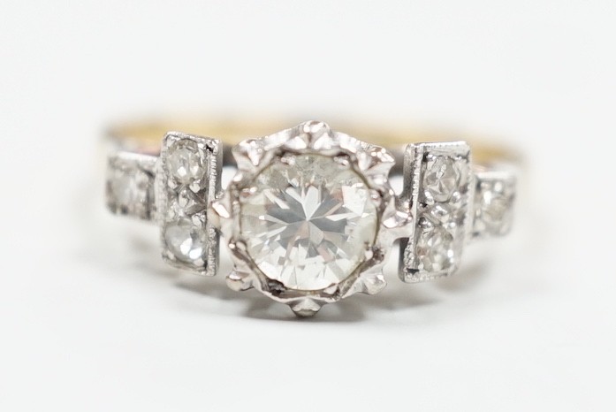 An 18ct and single stone diamond ring, with diamond set shoulders, size H, gross weight 2.6 grams                                                                                                                           