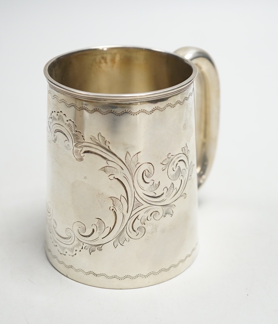 A Victorian engraved silver christening mug, Thomas White, Birmingham, 1872, 87mm.                                                                                                                                          