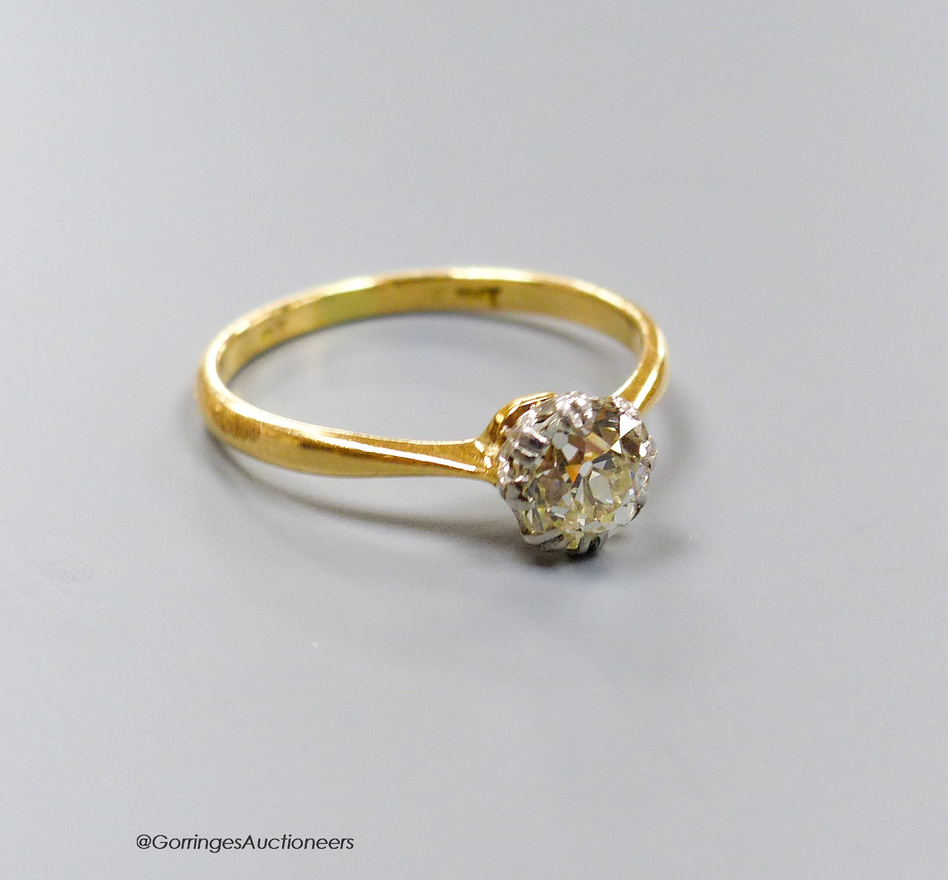 An 18ct and solitaire diamond ring, size O, gross 2.3 grams.                                                                                                                                                                