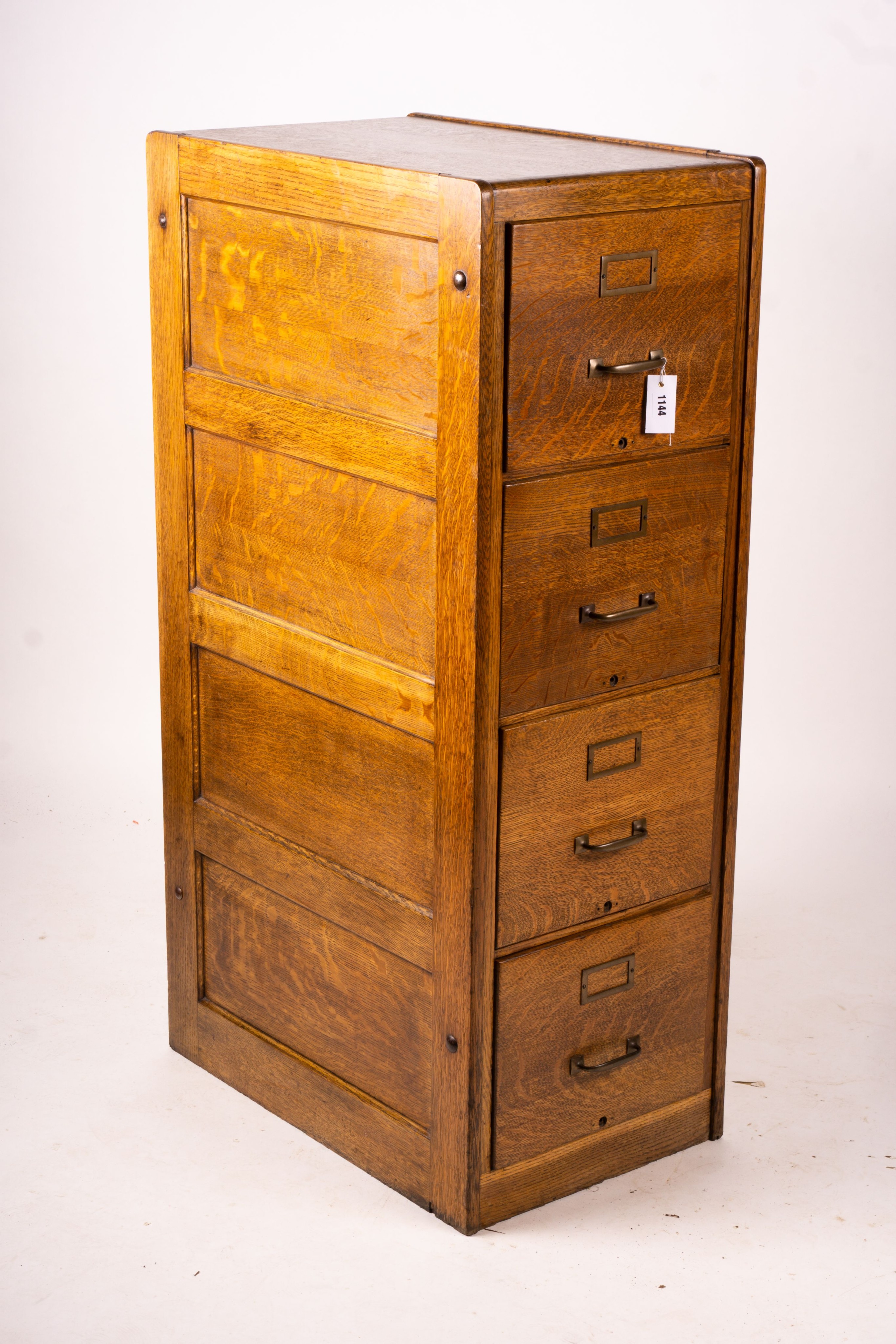 An early 20th century oak four drawer filing cabinet, W.44cm D.70cm. H.132cm                                                                                                                                                