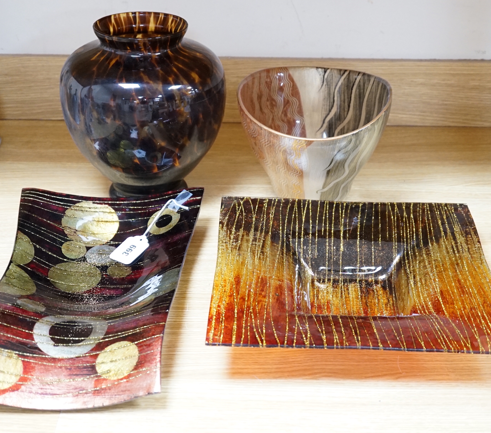 A faux tortoiseshell glass vase, an art glass vase and two Art glass dishes, the largest 41cm wide                                                                                                                          