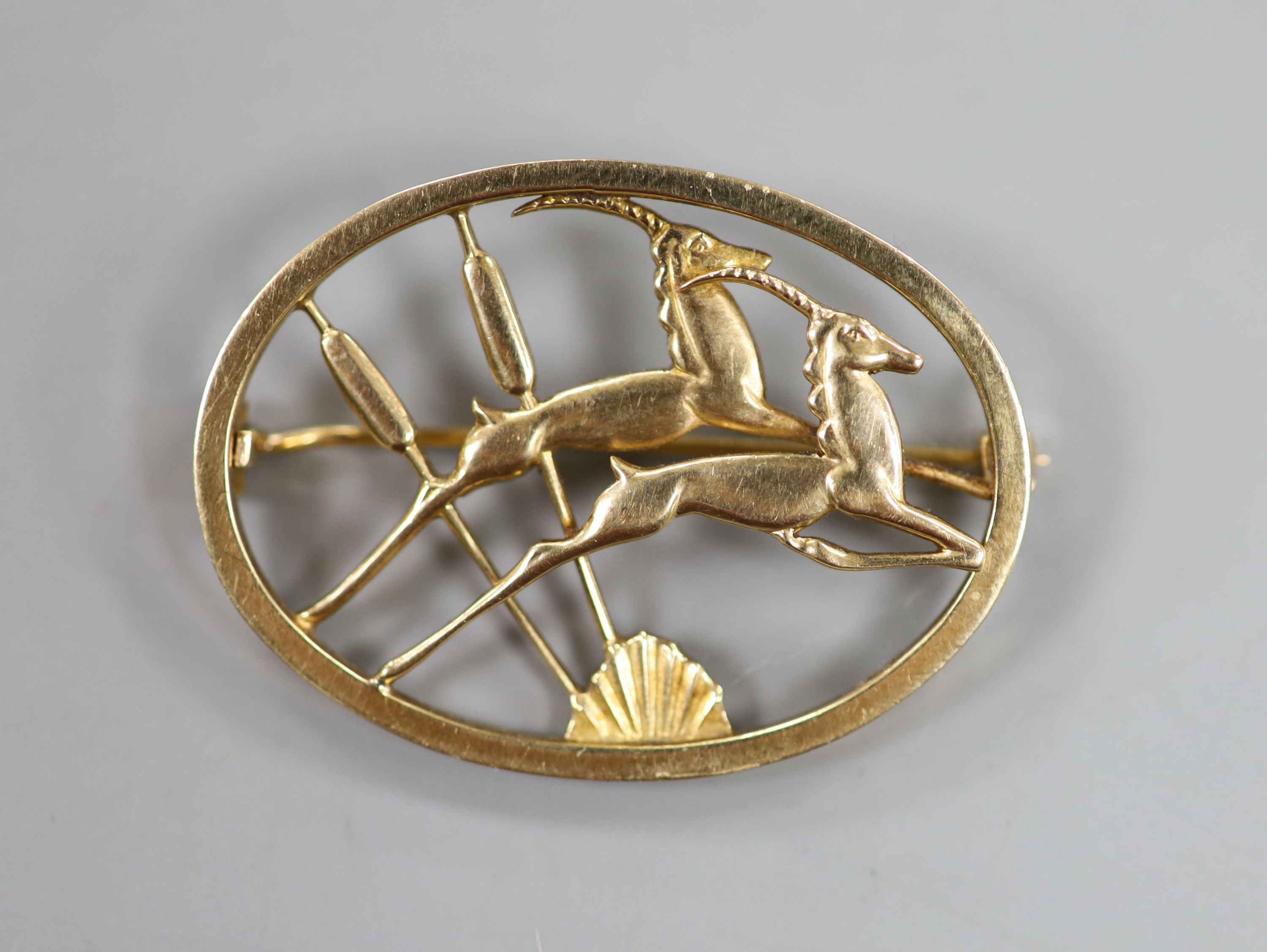 An Ivan Tarratt Georg Jensen style 9ct gold leaping antelope oval brooch, George Tarratt Ltd, Birmingham, 1962, 42mm, 11.5 grams.                                                                                           