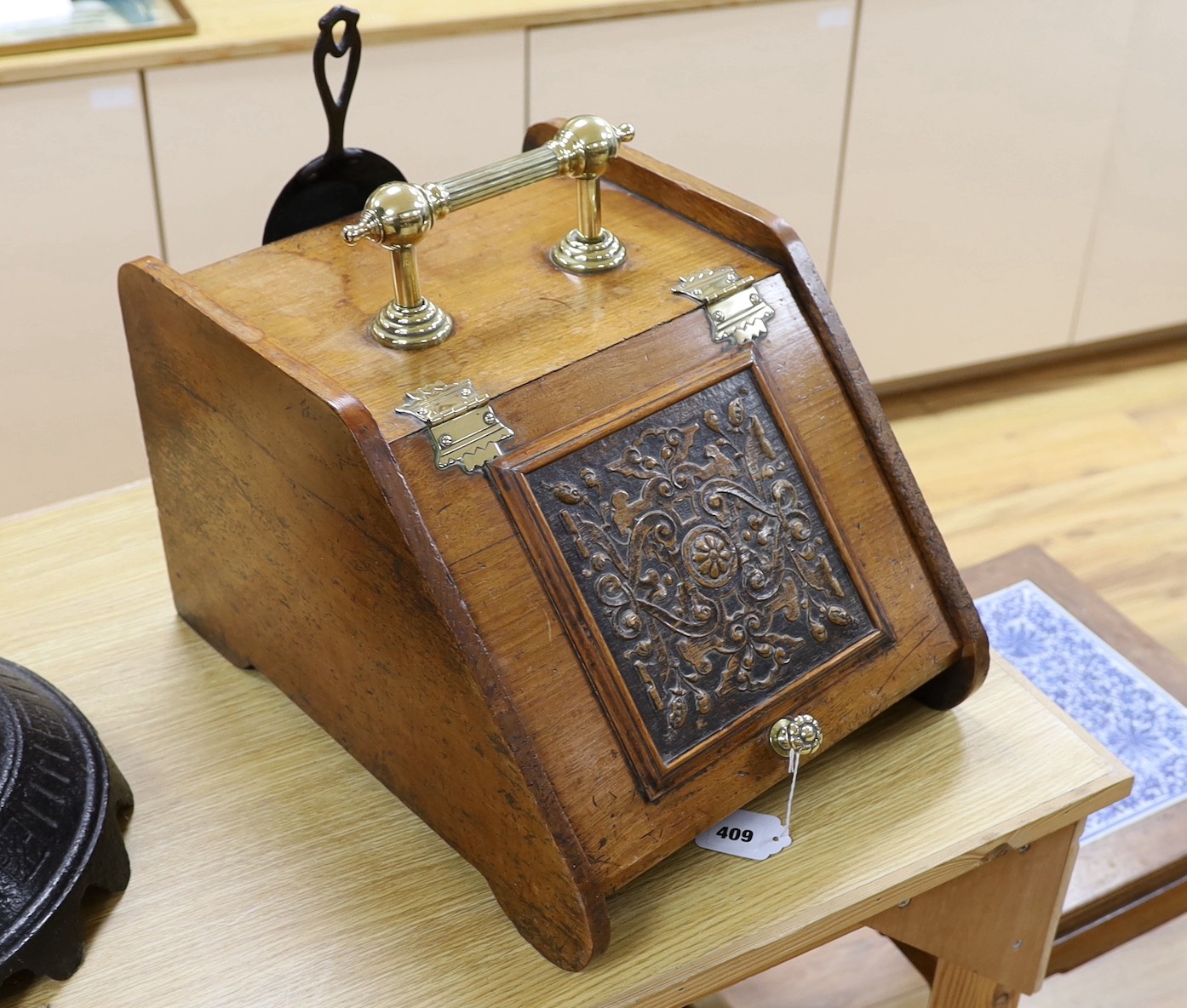 An Edwardian walnut brass handled and hinged perdonium, 28cms high x 45cms deep                                                                                                                                             