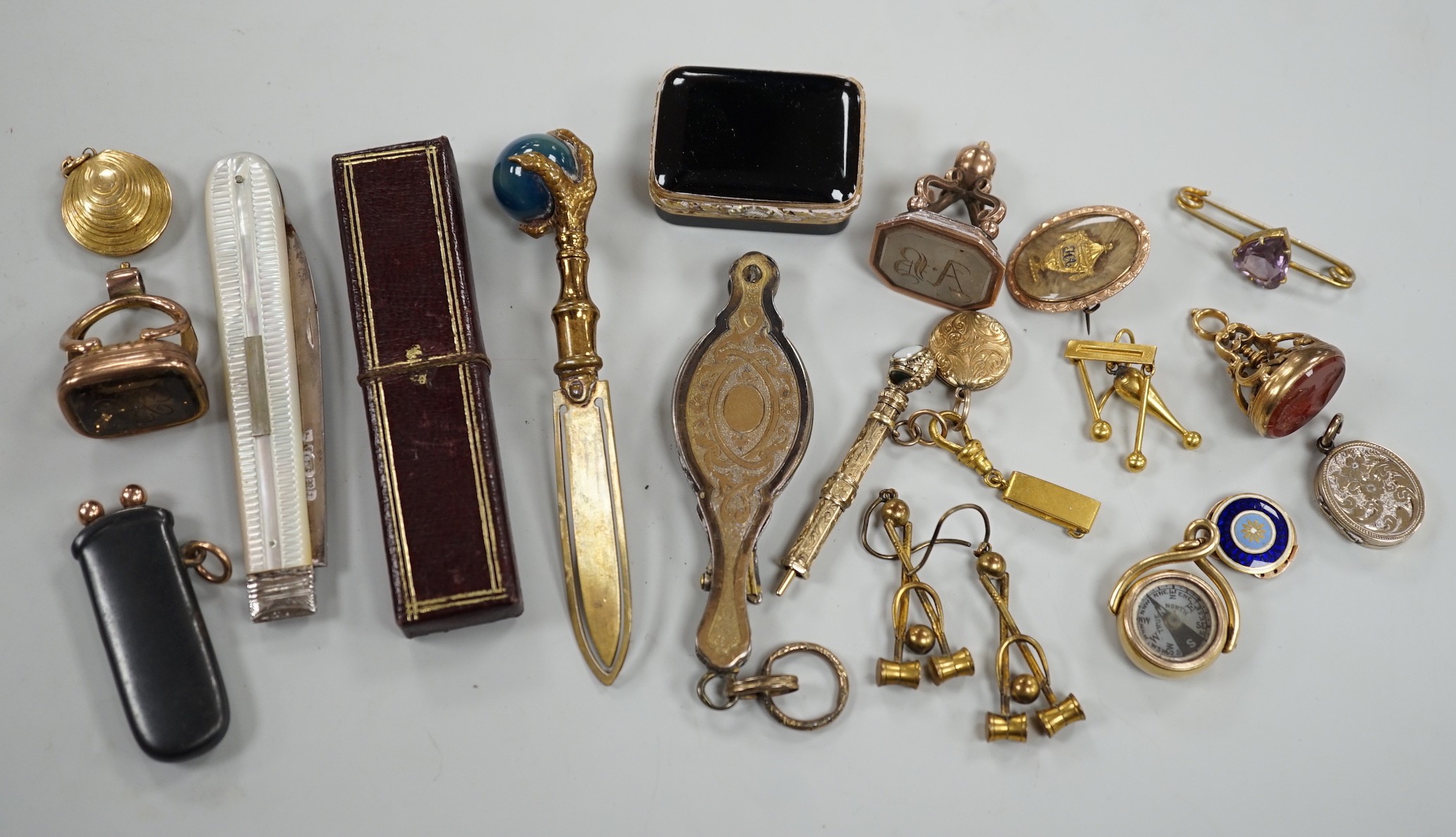 Mixed collectables including a yellow metal clam shell mourning pendant, 22mm, a George III yellow metal and plaited hair mourning brooch, with central urn and engraved inscription verso, three assorted 19th century and 
