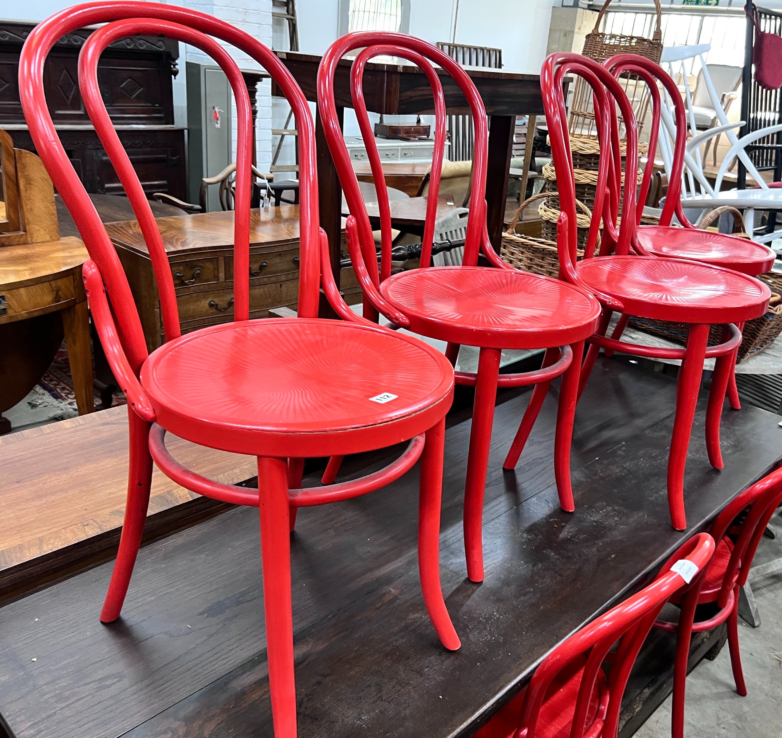 A set of six modern red painted bentwood type dining chairs *Please note the sale commences at 9am.                                                                                                                         