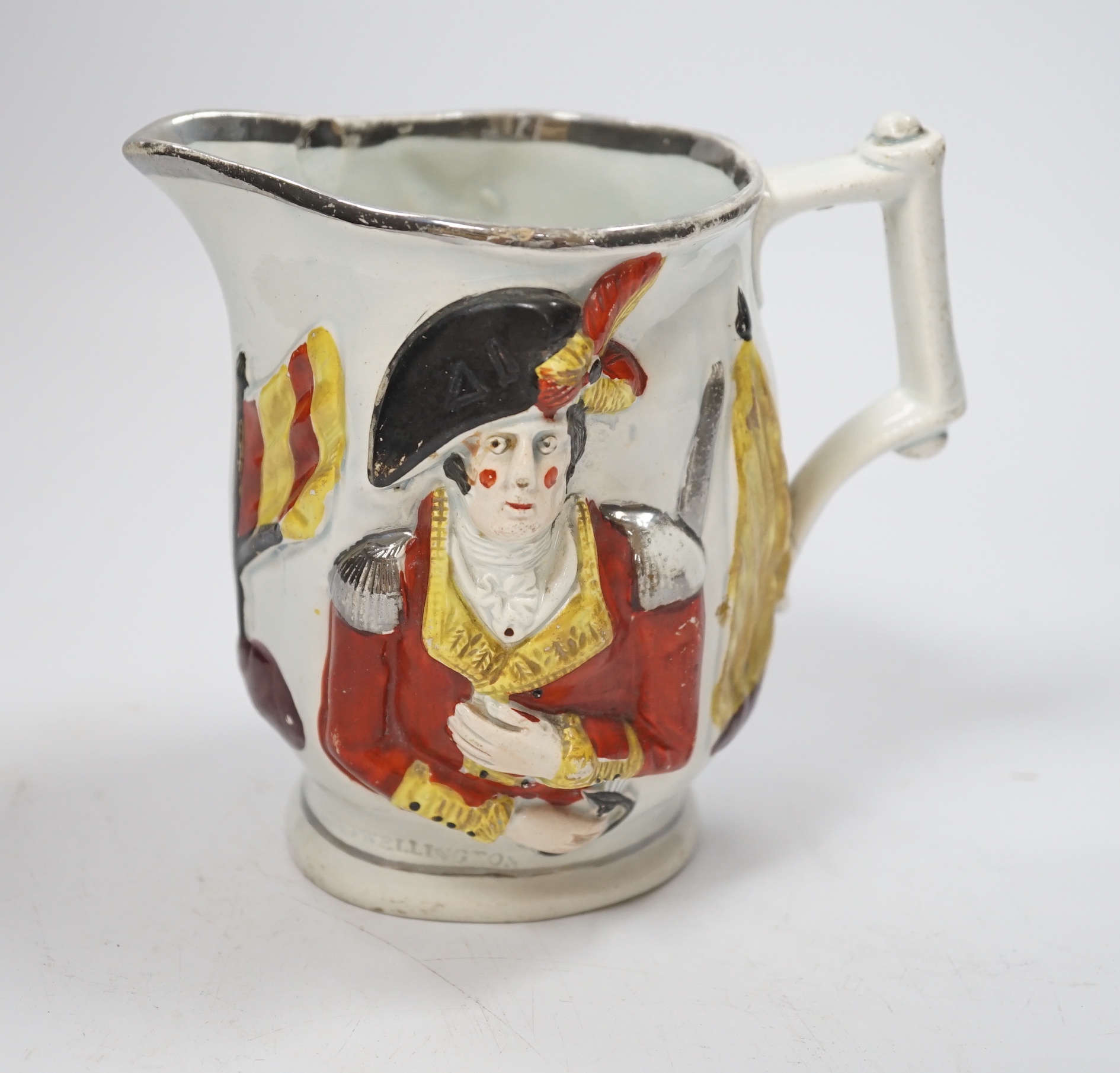 An early 19th century pearlware Lord Wellington / General Hill relief-moulded commemorative jug, 14cm                                                                                                                       