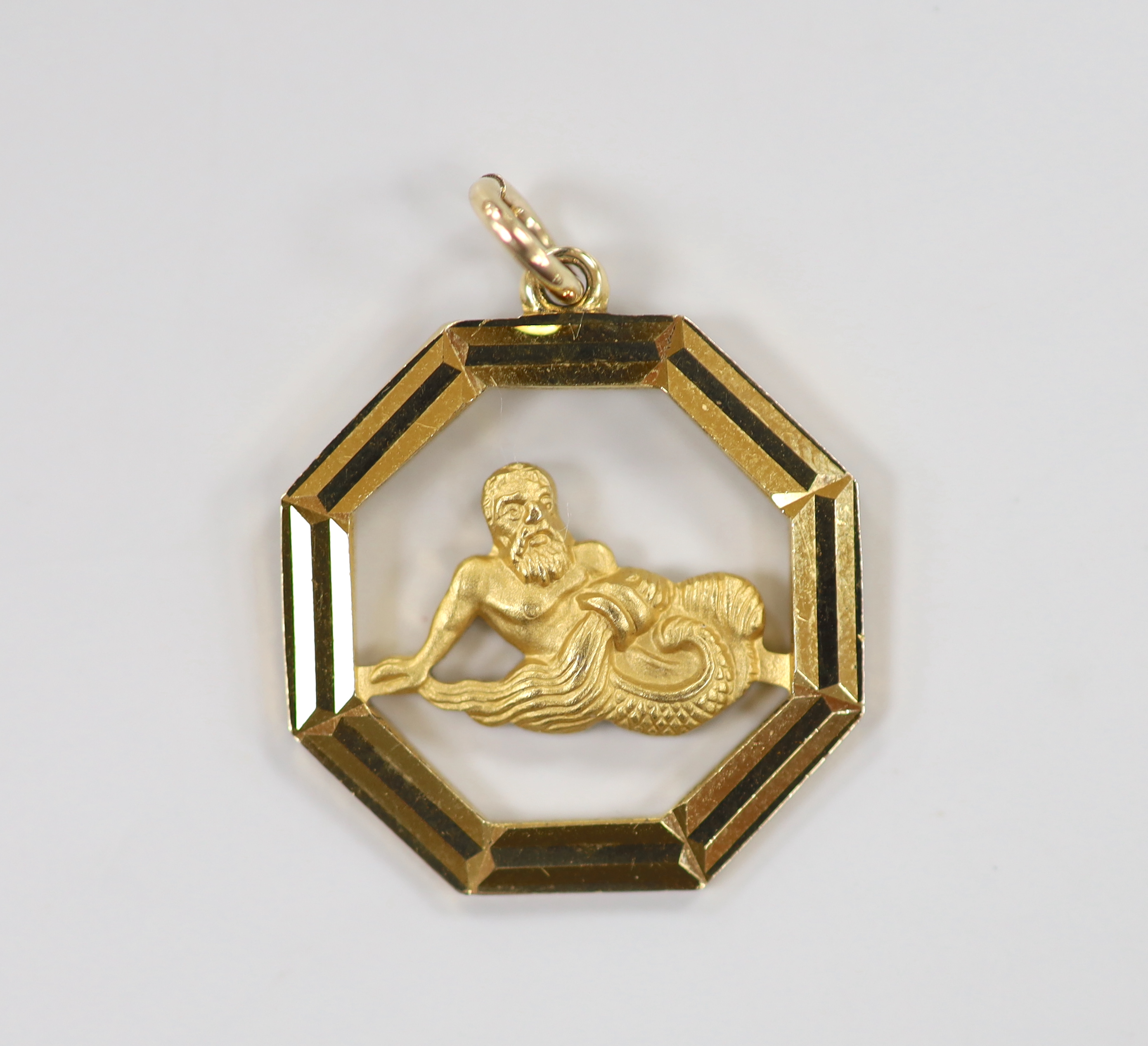 A late 1960's Georg Jensen Ltd 9ct gold octagonal open work pendant, depicting Poseidon?, 21mm, gross weight 3.7 grams.                                                                                                     