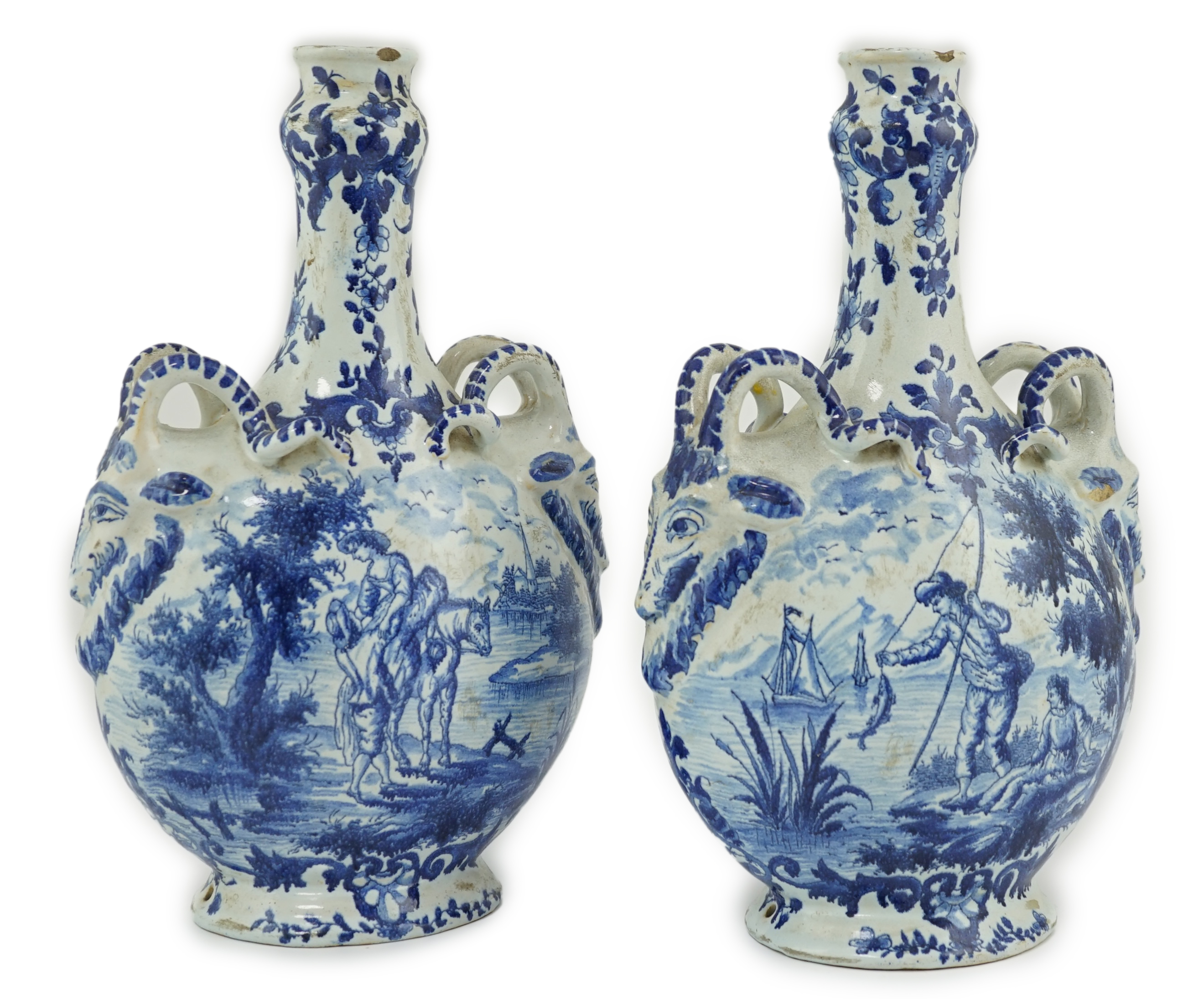 A pair of mid 18th century Delft blue and white flagons                                                                                                                                                                     