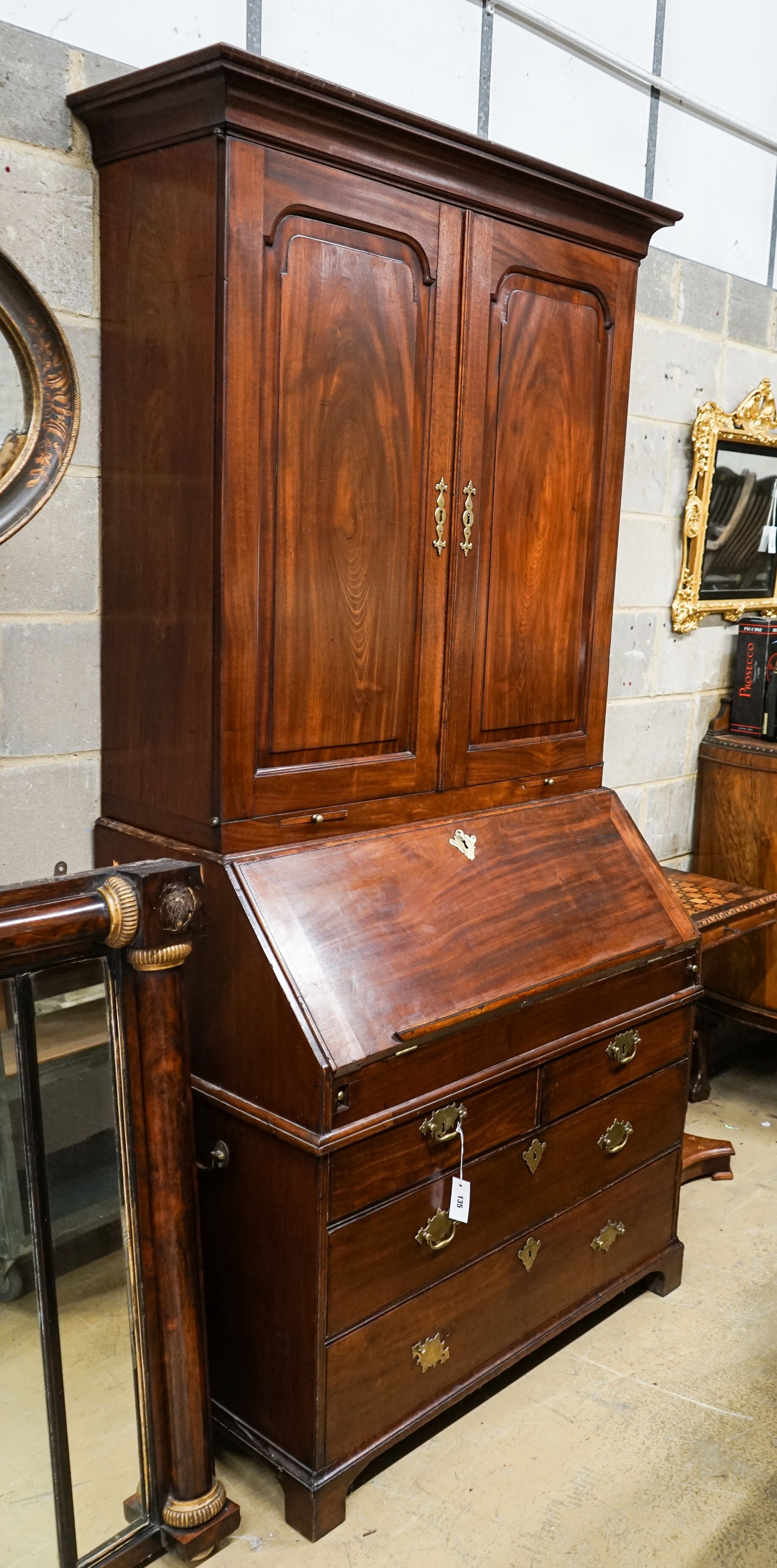 A George III mahogany bureau bookcase, length 99cm, depth 59cm, height 212cm                                                                                                                                                