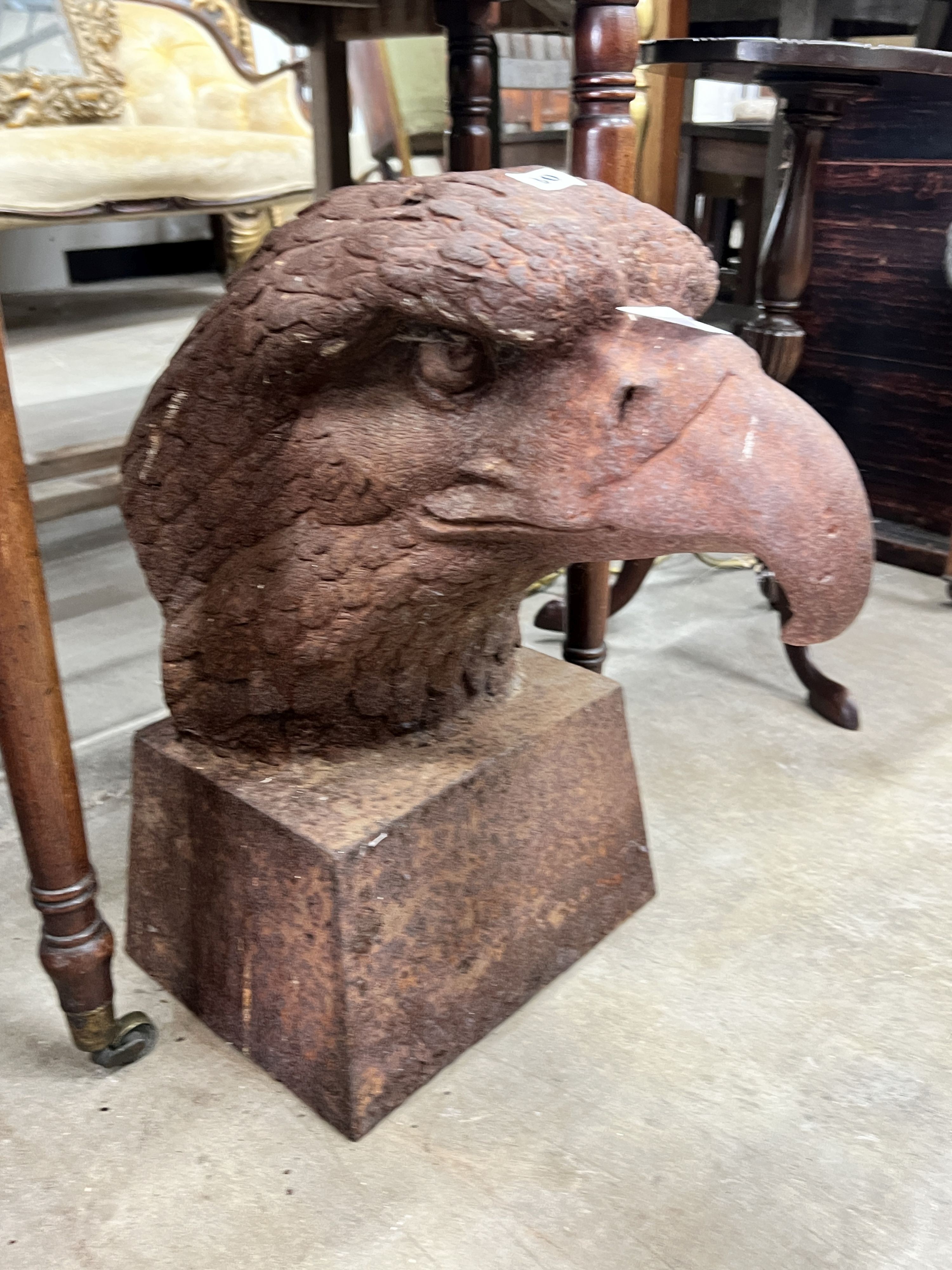 A large weathered cast iron eagle's head garden finial, height 44cm                                                                                                                                                         