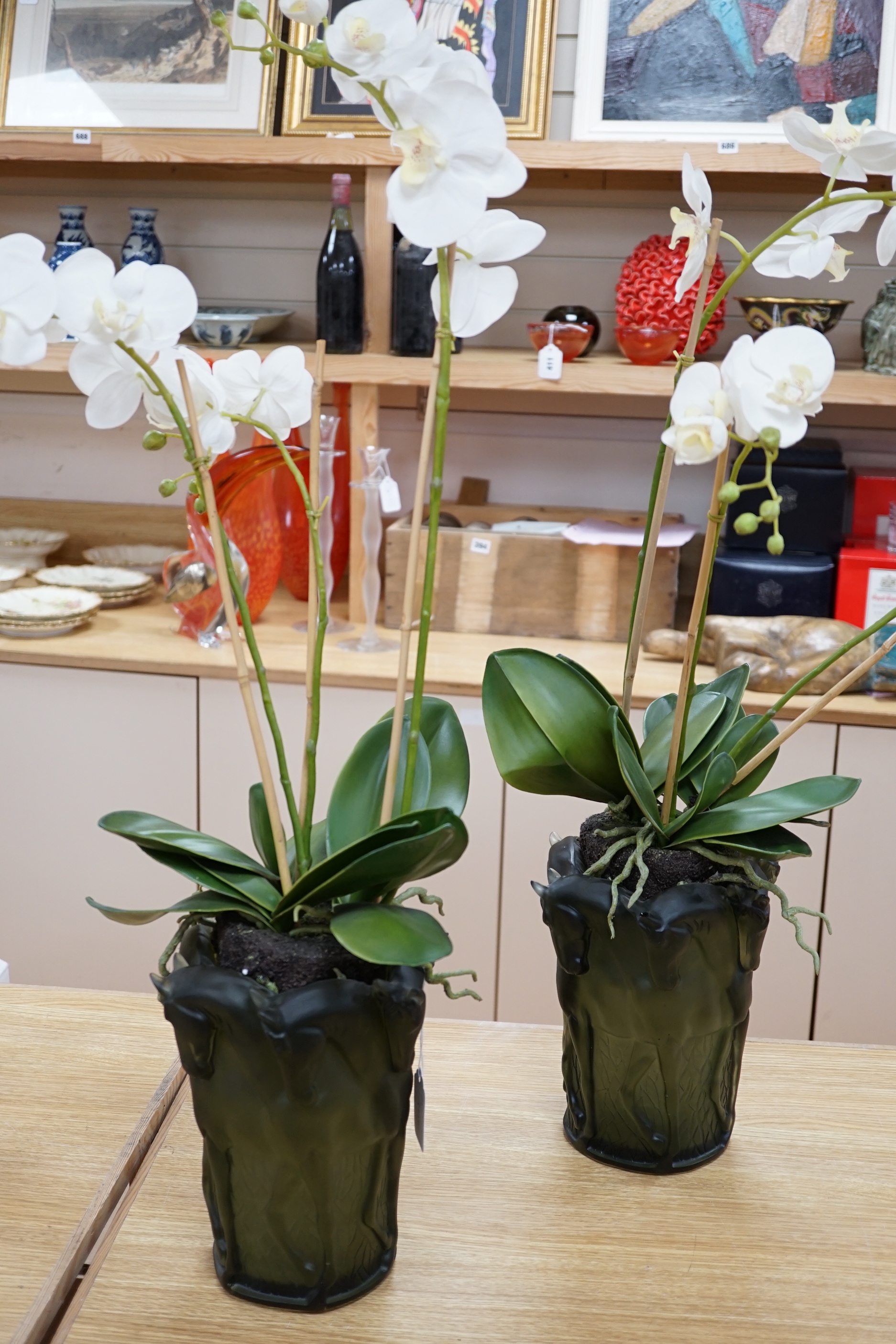 A pair of green glass Lalique style 'Haviland' signed vases with horse design and faux orchid plants within, 26cm high                                                                                                      
