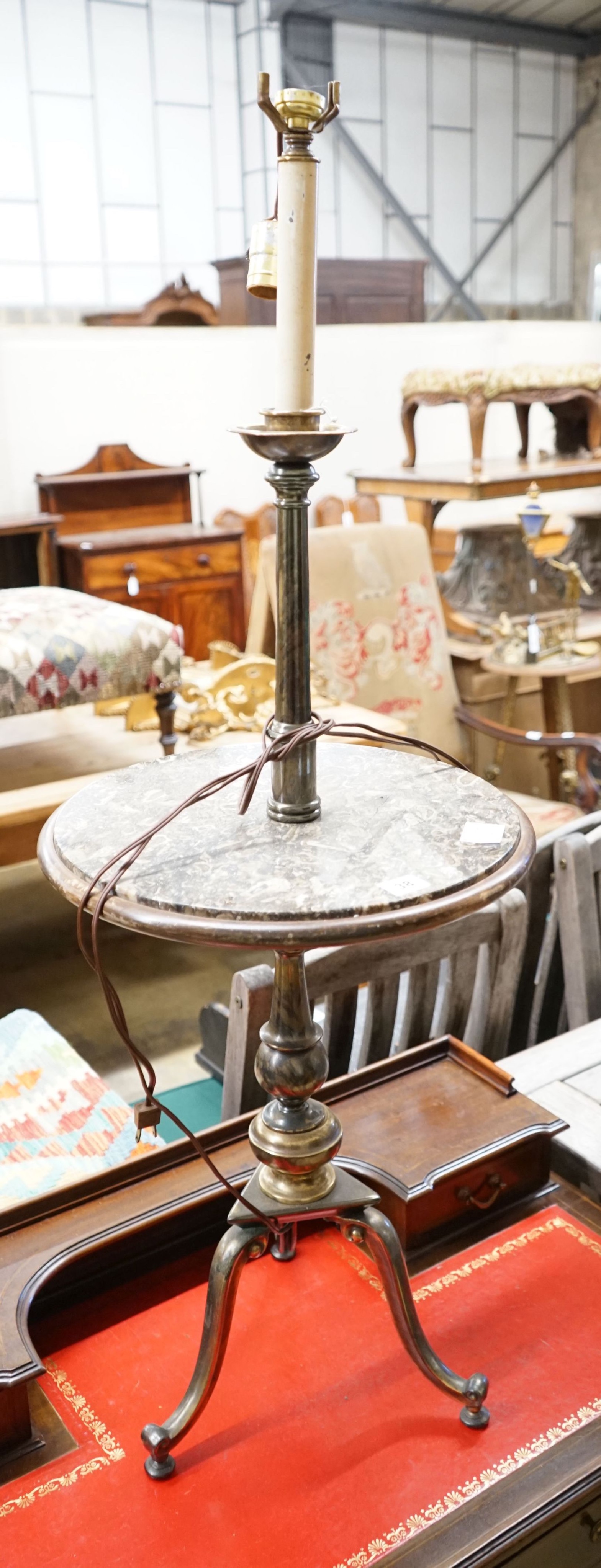 A polished gilt metal and marble tripod floor lamp, height 110cm                                                                                                                                                            