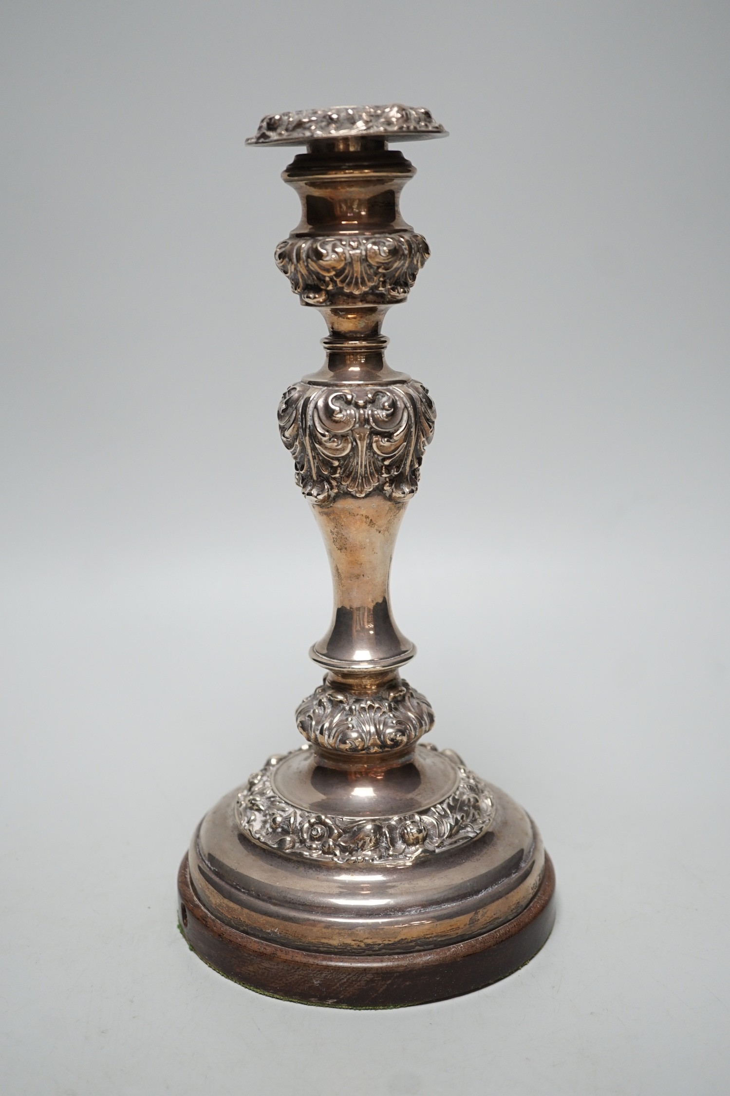 A George IV silver candlestick, Thomas Blagden & Co, Sheffield, 1822, now mounted on a later wooden base, with drill hole for electricity??, overall height 26.9cm.                                                         