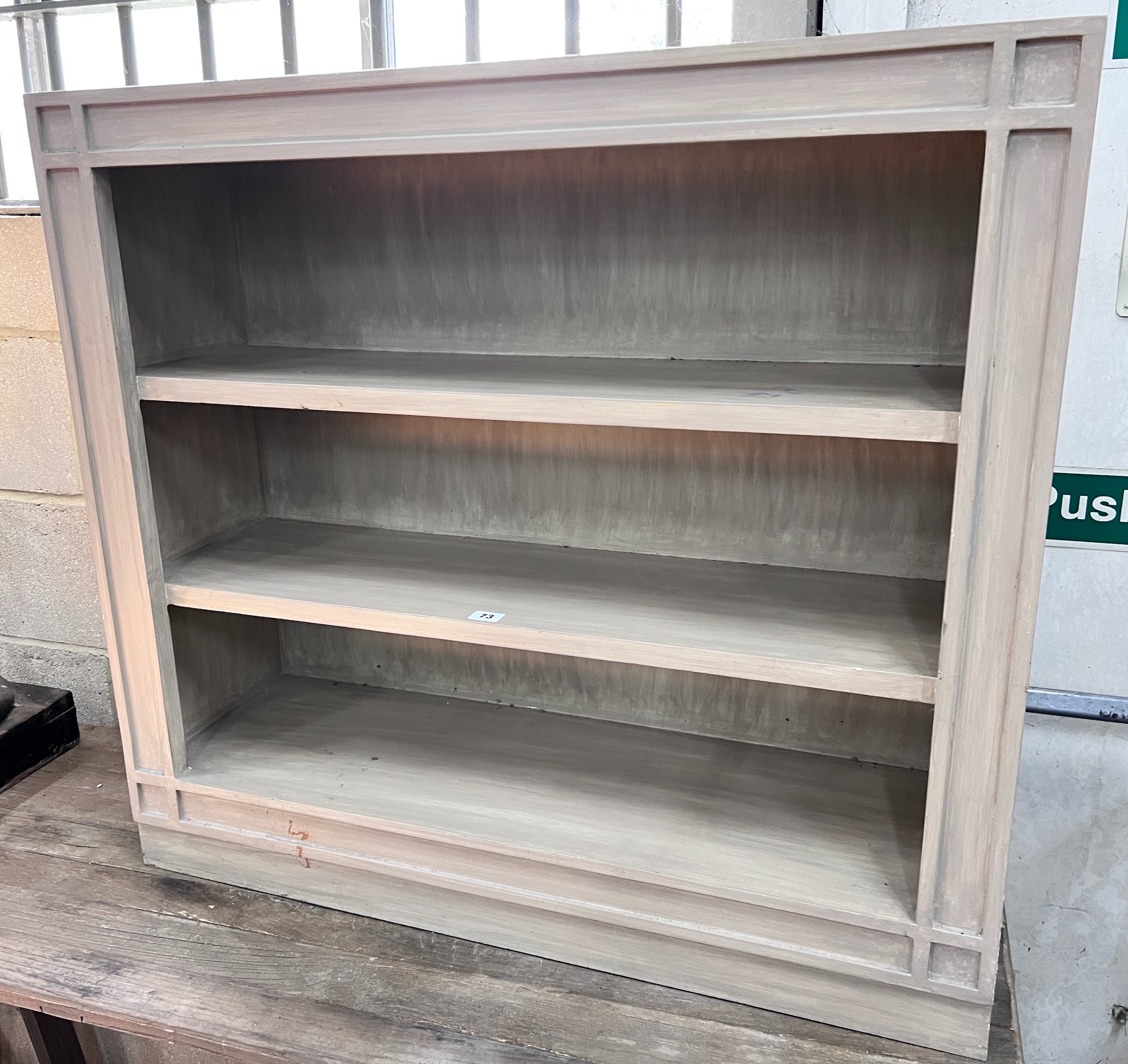 A contemporary painted open three-shelf bookcase, width 90cm, depth 28cm, height 83cm *Please note the sale commences at 9am.                                                                                               