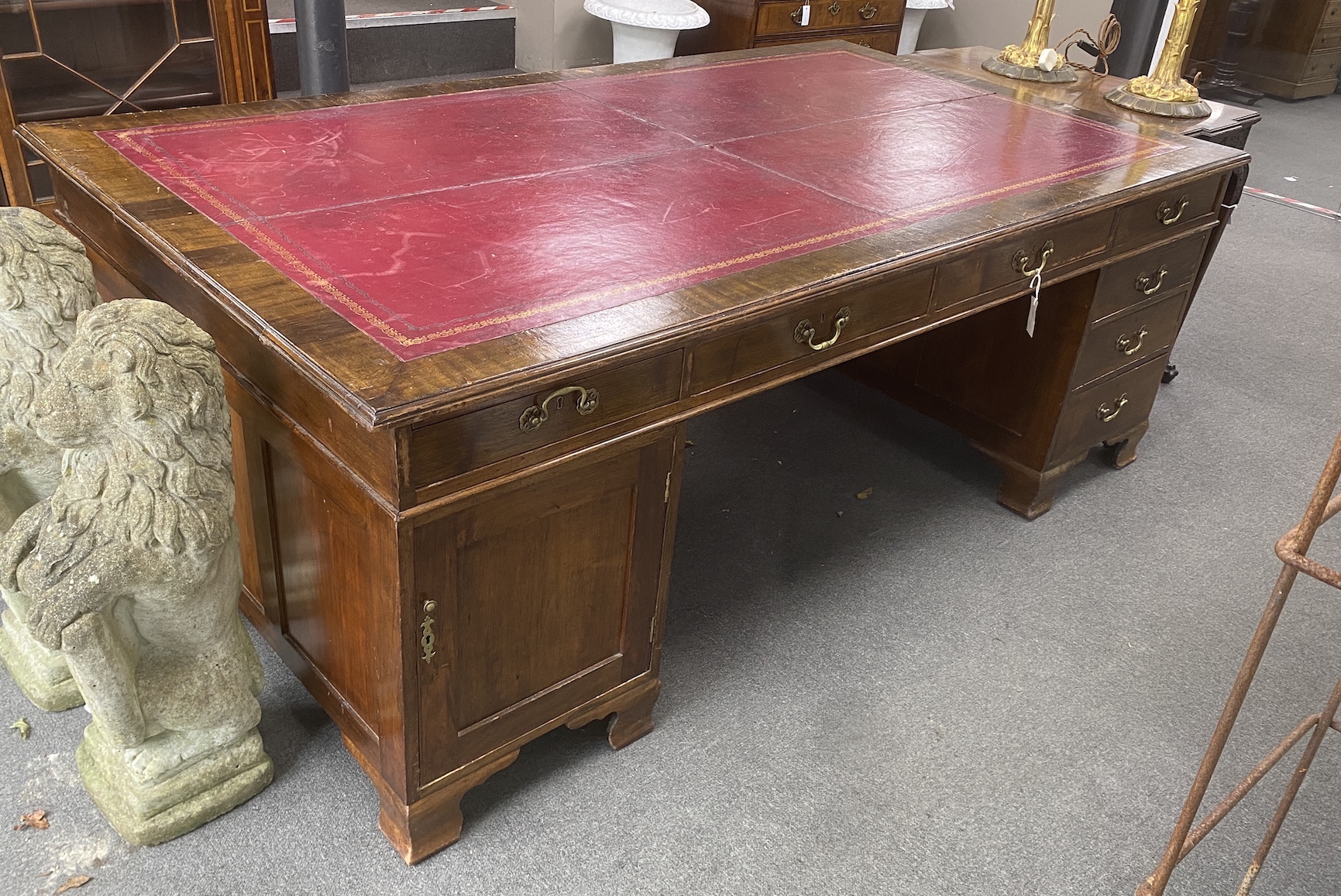 A large 1920's George III mahogany pedestal partner's desk, two drawers Phillip, Bristol, length 214cm, width 120cm, height 78cm                                                                                            