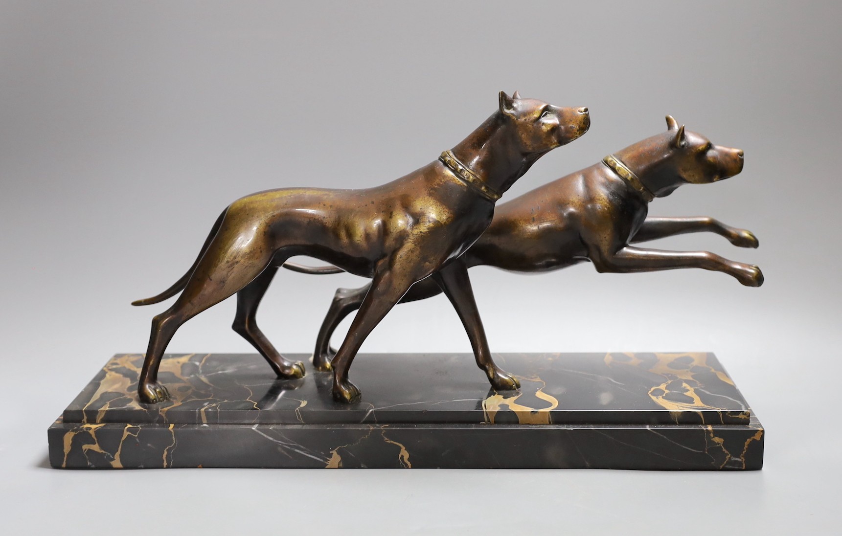 A French bronze model of two Great Danes, signed Fugere on marble base, 42 cms wide                                                                                                                                         