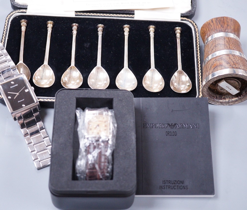 A cased set of eight George VI silver 'The Salisbury Seal Top' coffee spoons, J. Sidney Rumbridge, Sheffield, 1938, a late Victorian silver mounted wooden pepper mill and two gentleman's modern wrist watches.            