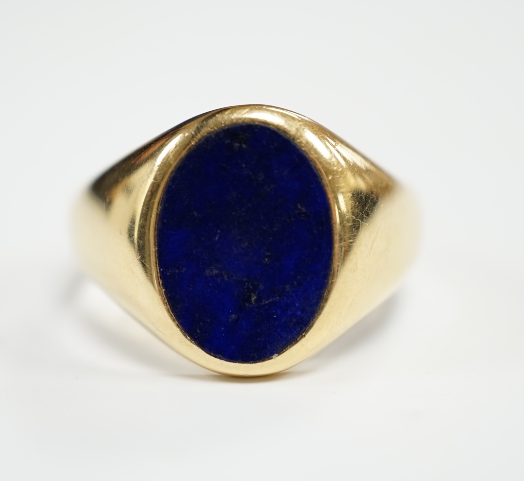 A George V 18ct gold and oval lapis lazuli set signet ring, hallmarked for Chester, 1915, size U, gross weight 8.5 grams.                                                                                                   