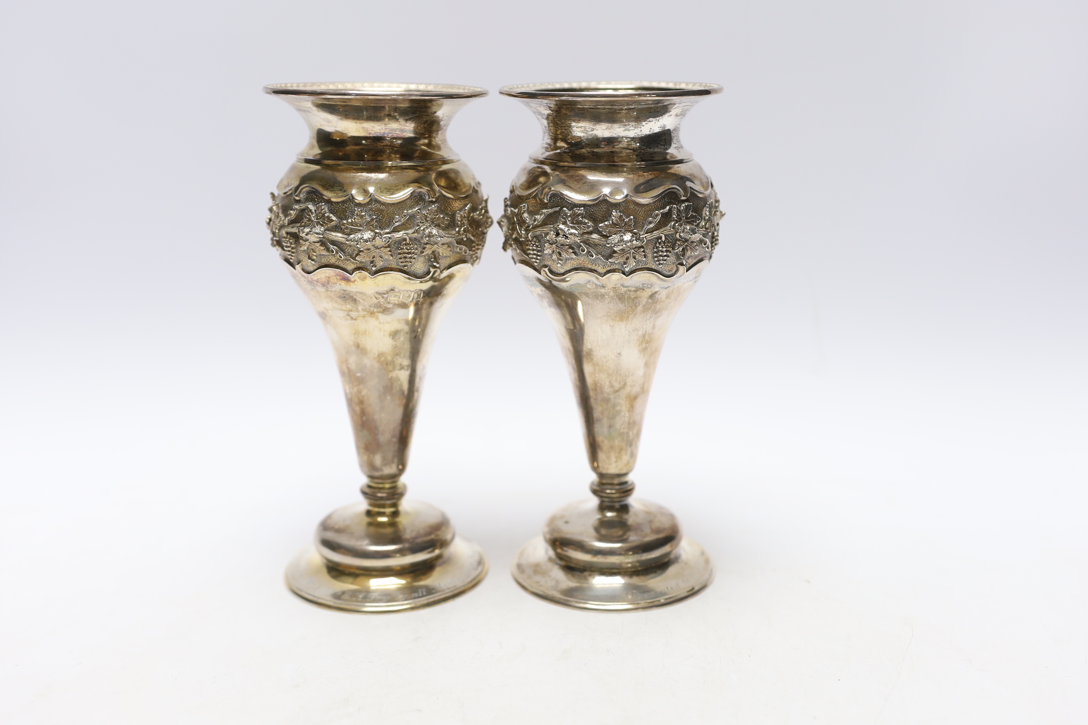 A pair of George V silver mounted posy vases, with engraved presentation inscriptions, London, 1912, 18.6cm.                                                                                                                