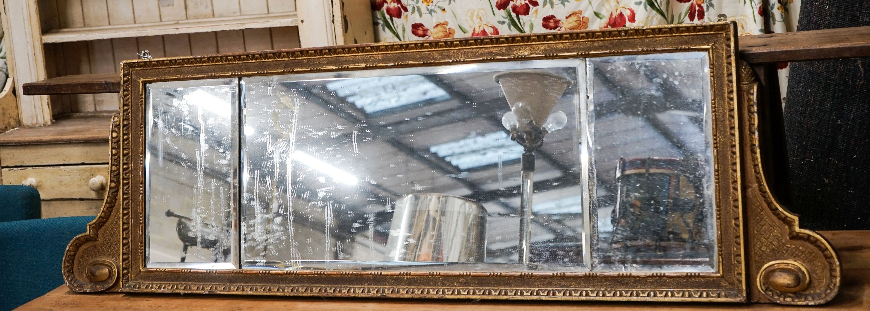 A 19th century giltwood and gesso triple plate overmantel mirror, width 164cm, height 49cm                                                                                                                                  