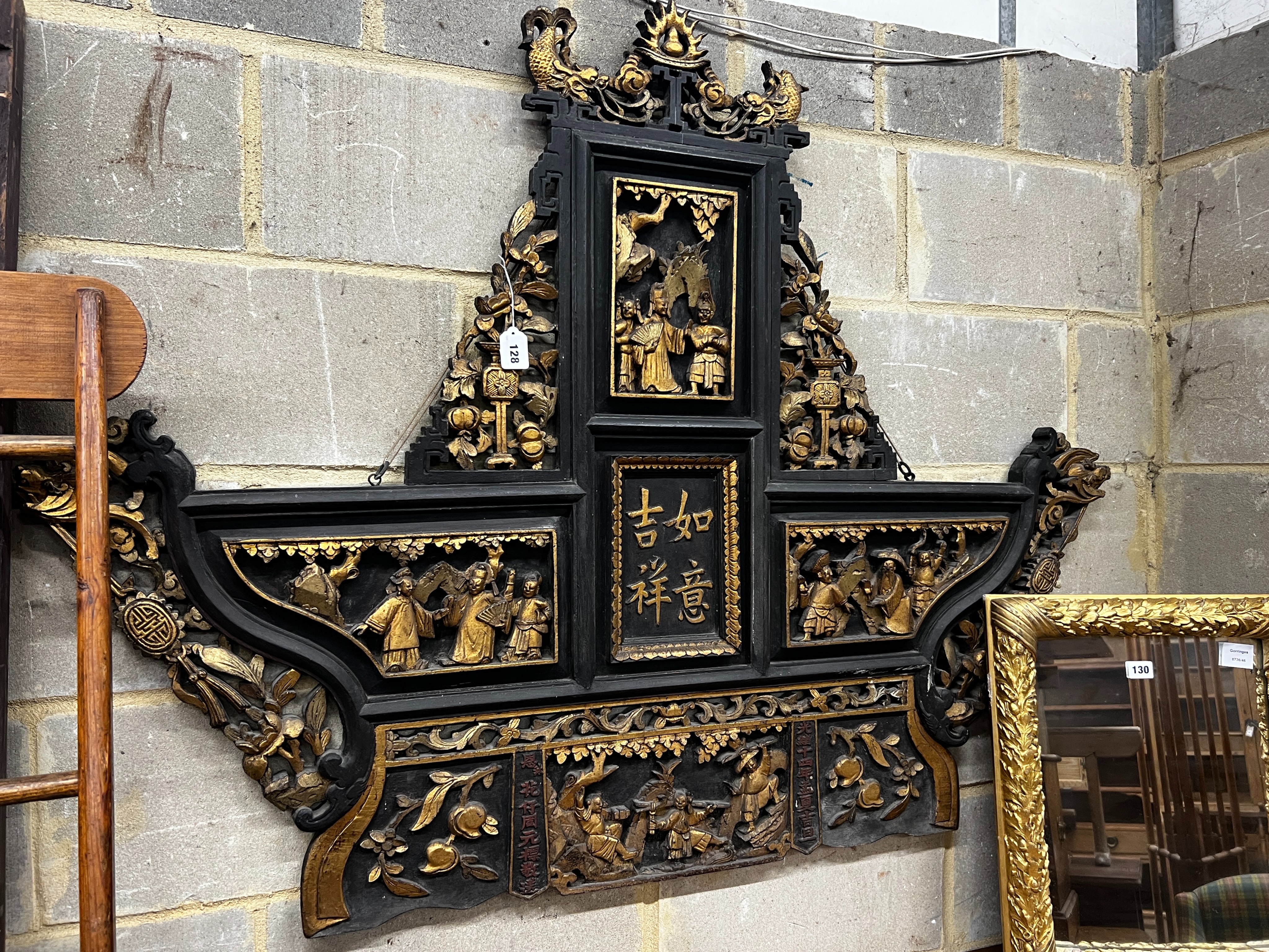 A Chinese carved parcel gilt lacquer wall plaque, width 140cm, height 107cm                                                                                                                                                 