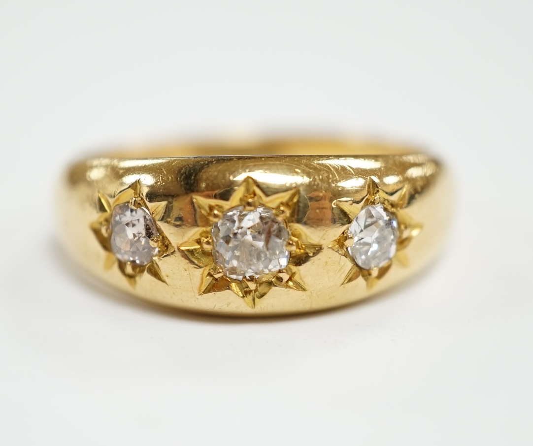 A George V 18ct gold and gypsy set three stone diamond ring, hallmarked for London, 1910, size S, gross weight 9.1 grams.                                                                                                   