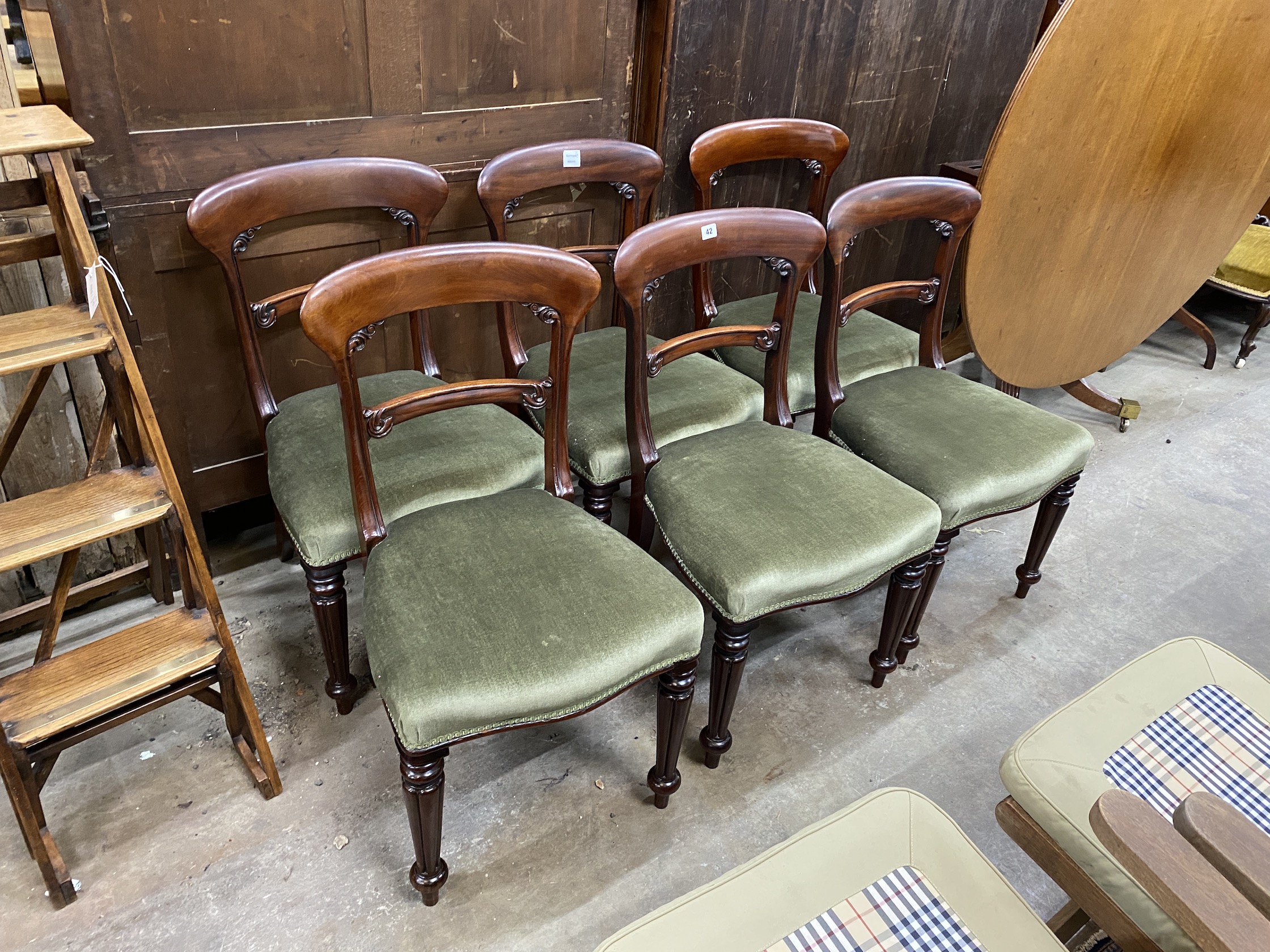 A set of six Victorian mahogany dining chairs, on turned fluted legs                                                                                                                                                        