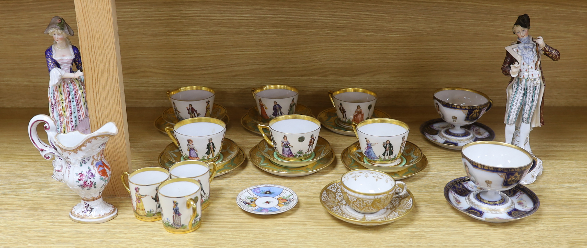 A group of European porcelain tableware to include a pair of figures, Lowestoft jug, Dresden cups etc.                                                                                                                      