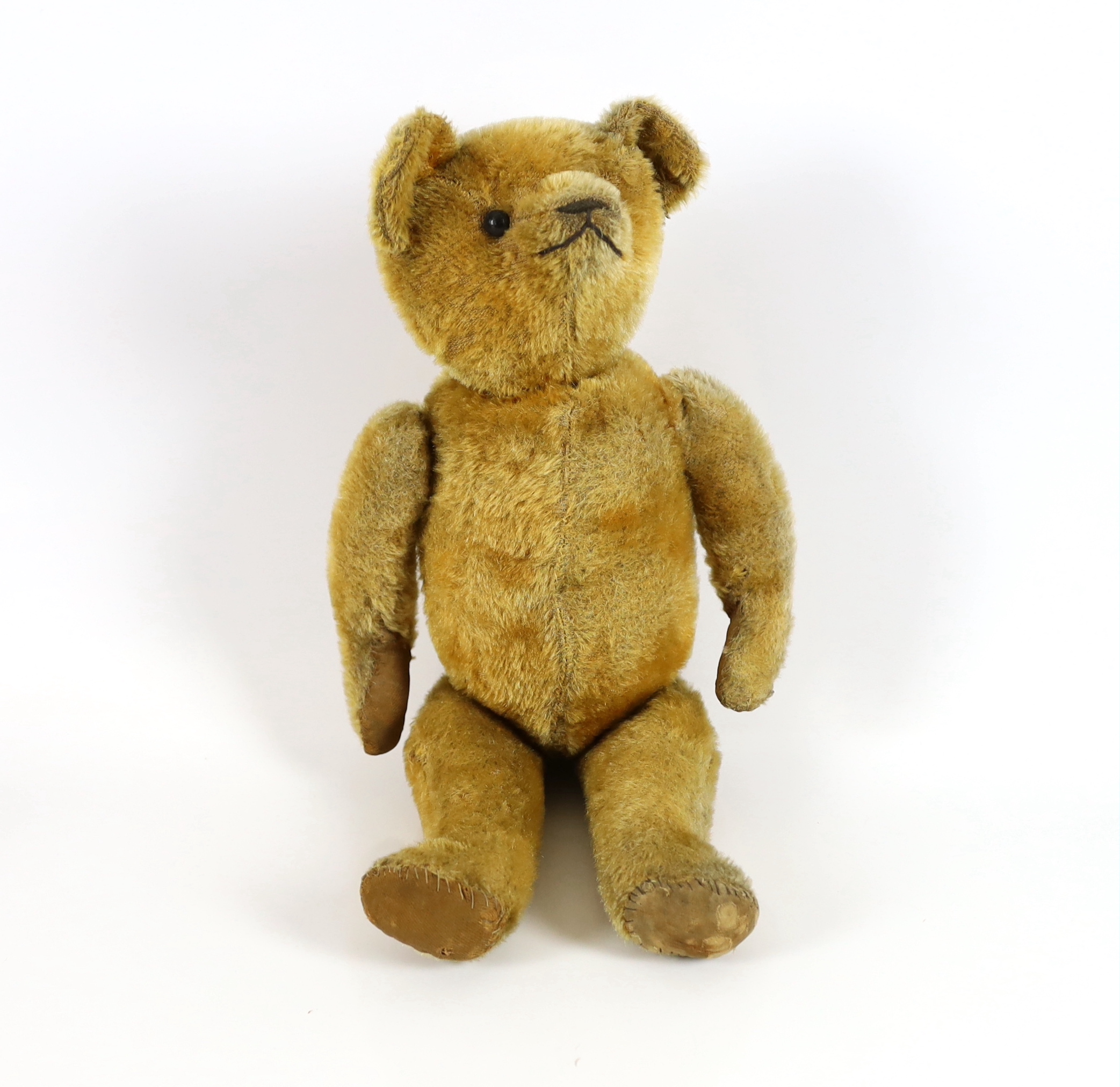 An early bear, possibly American c.1913, 40cm, in good condition, old repairs to paws                                                                                                                                       