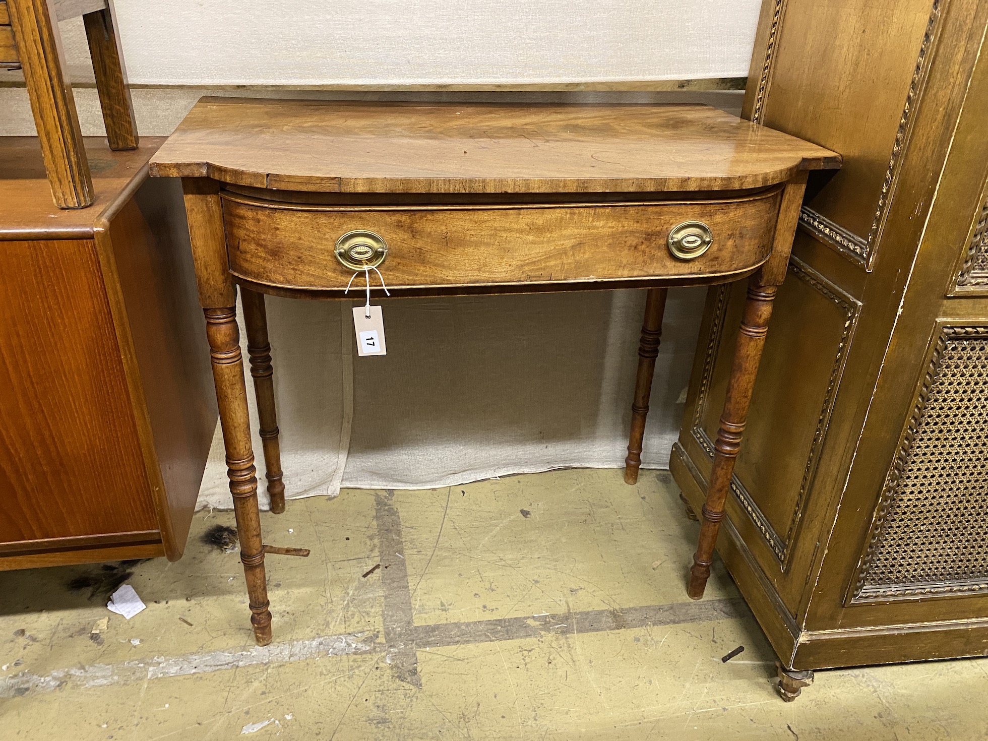 A Regency mahogany bowfront side table, width 91cm, depth 53cm, height 85cm                                                                                                                                                 