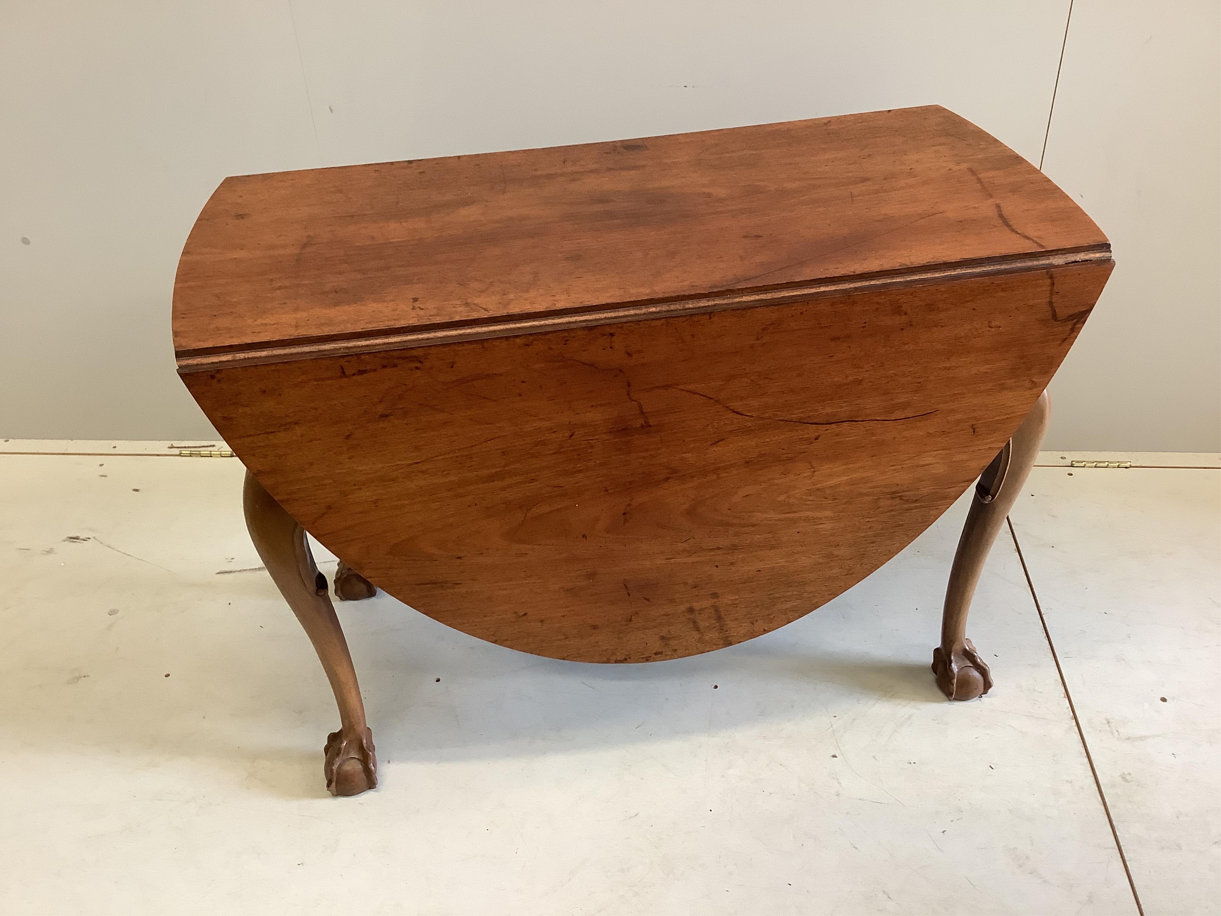 A George III style oval mahogany drop leaf dining table, 155cm extended, depth 106cm, height 74cm, together with a Regency style mahogany bowfront sideboard and six Hepplewhite style mahogany dining chairs. Condition - f