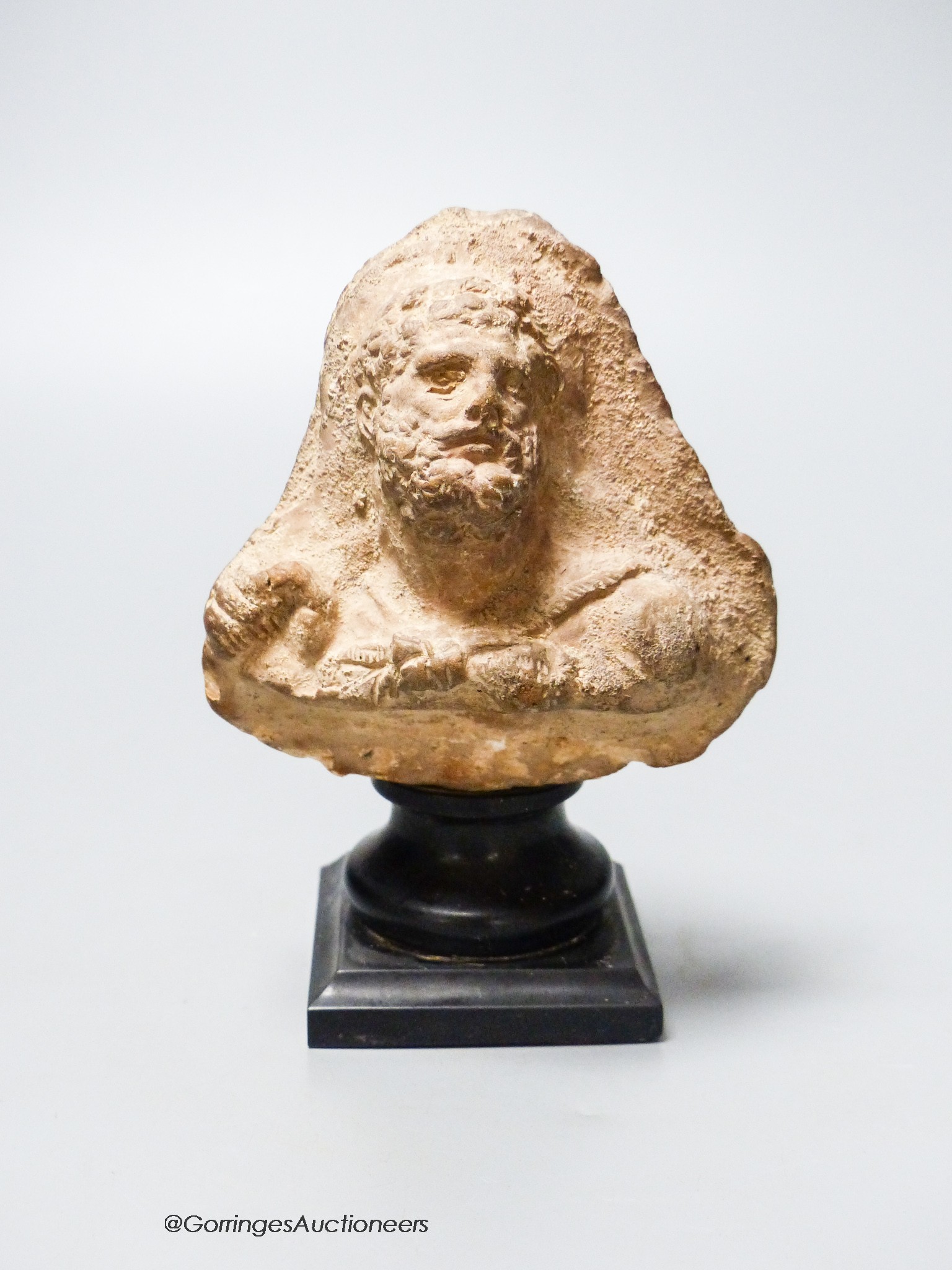 An Etruscan terracotta bearded portrait bust, height 12.5cm                                                                                                                                                                 