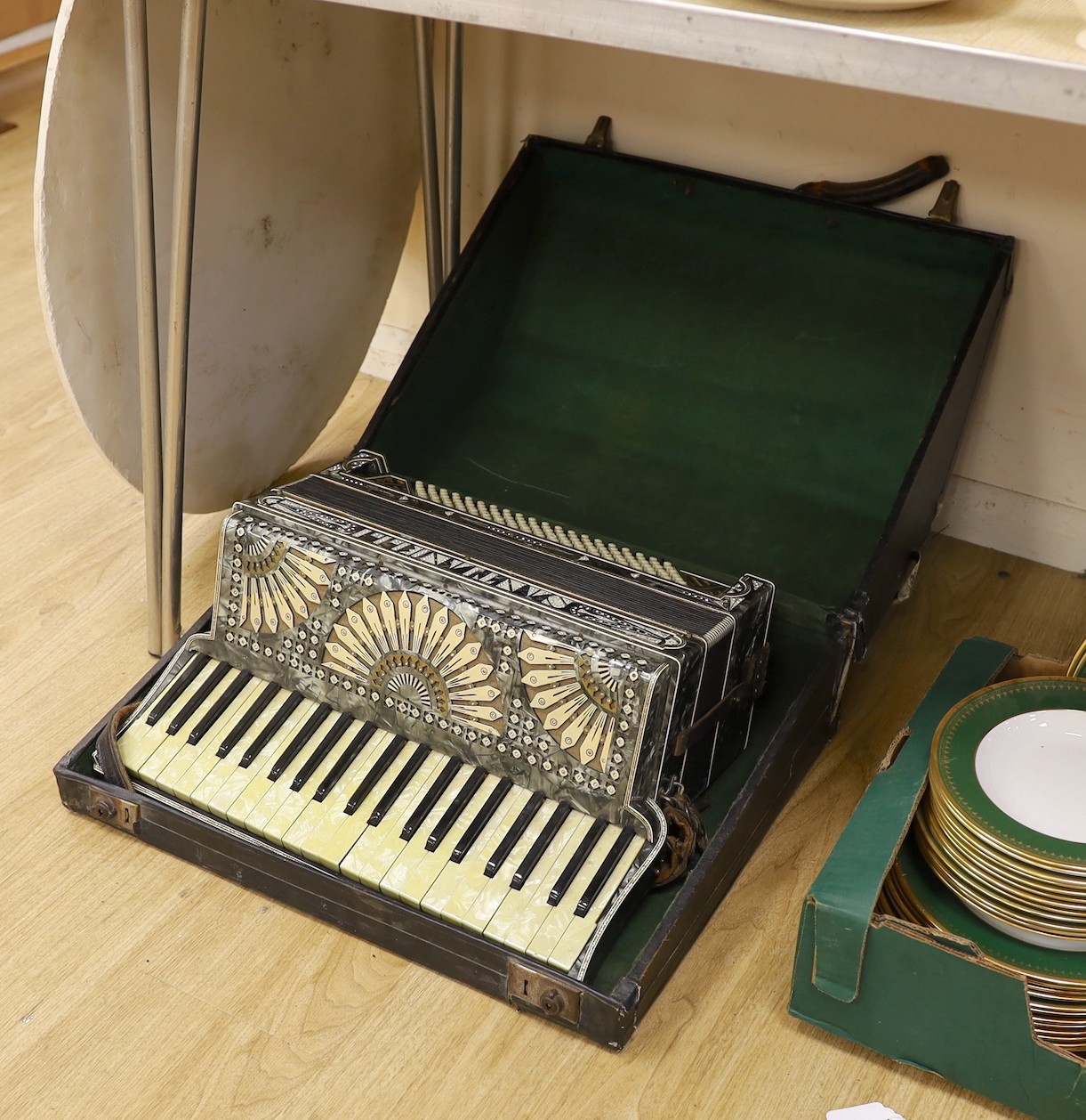 A cased Santiarelli cased accordion, 51 cms wide                                                                                                                                                                            