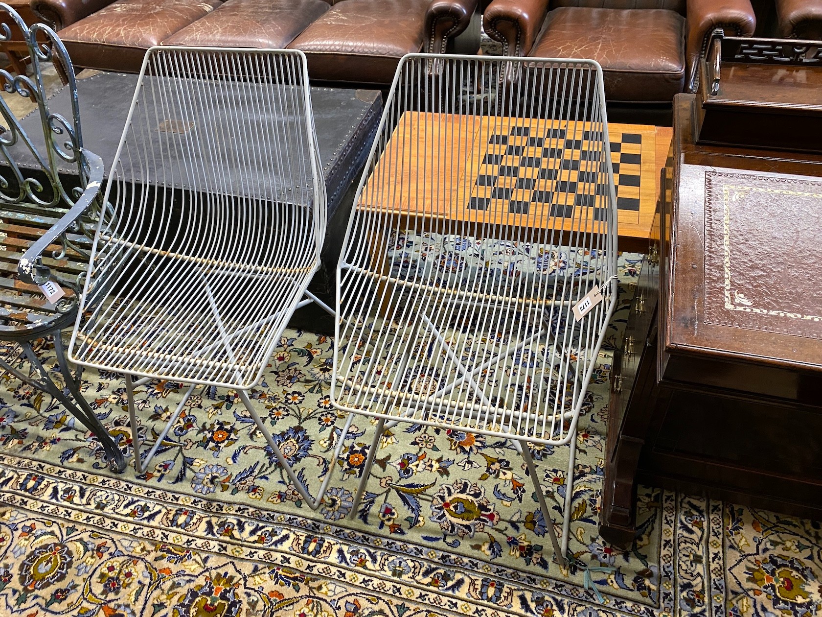 A pair of painted wirework garden chairs, height 85cm                                                                                                                                                                       