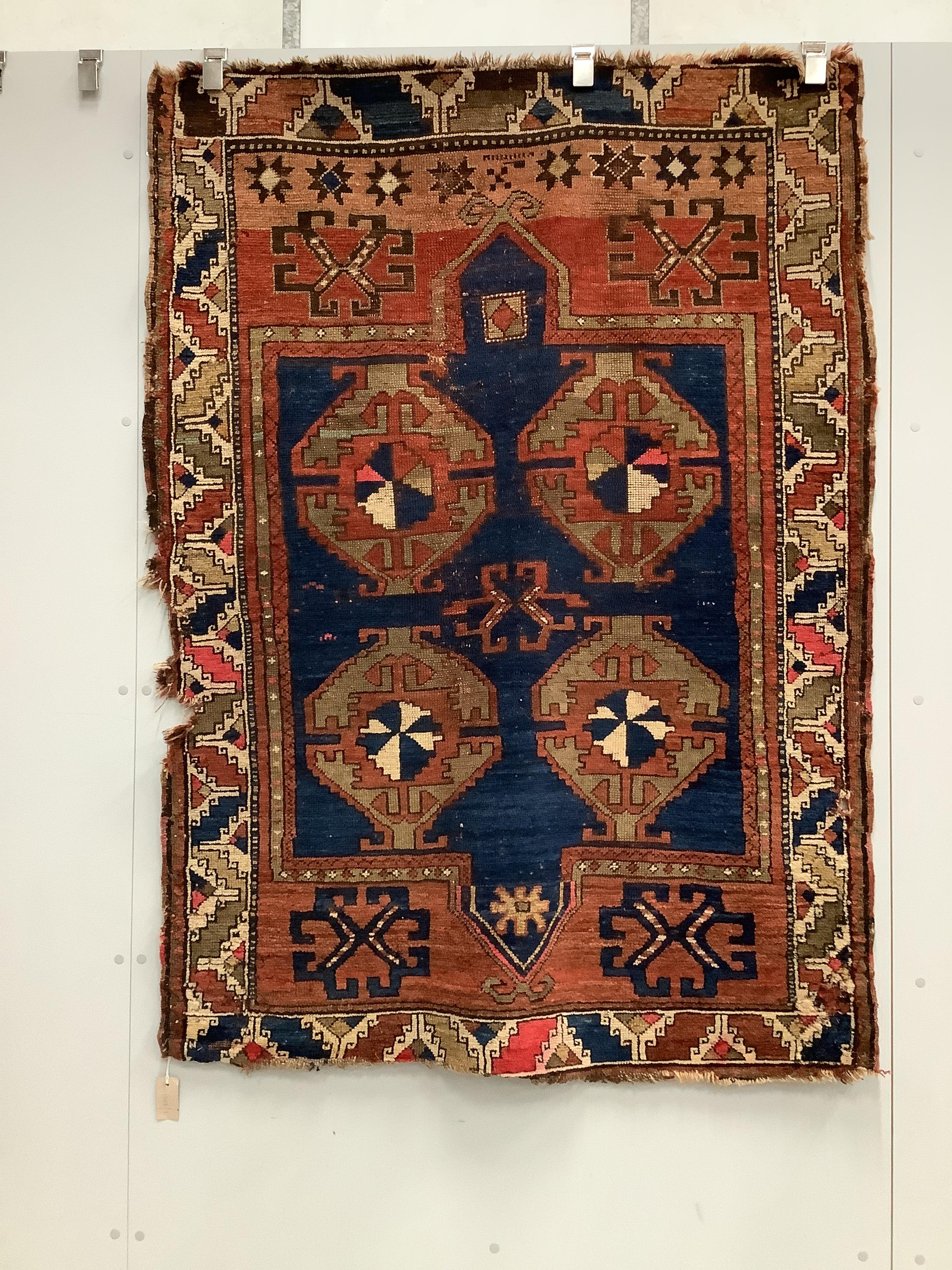 An antique Caucasian blue ground rug, 160 x 115cm                                                                                                                                                                           
