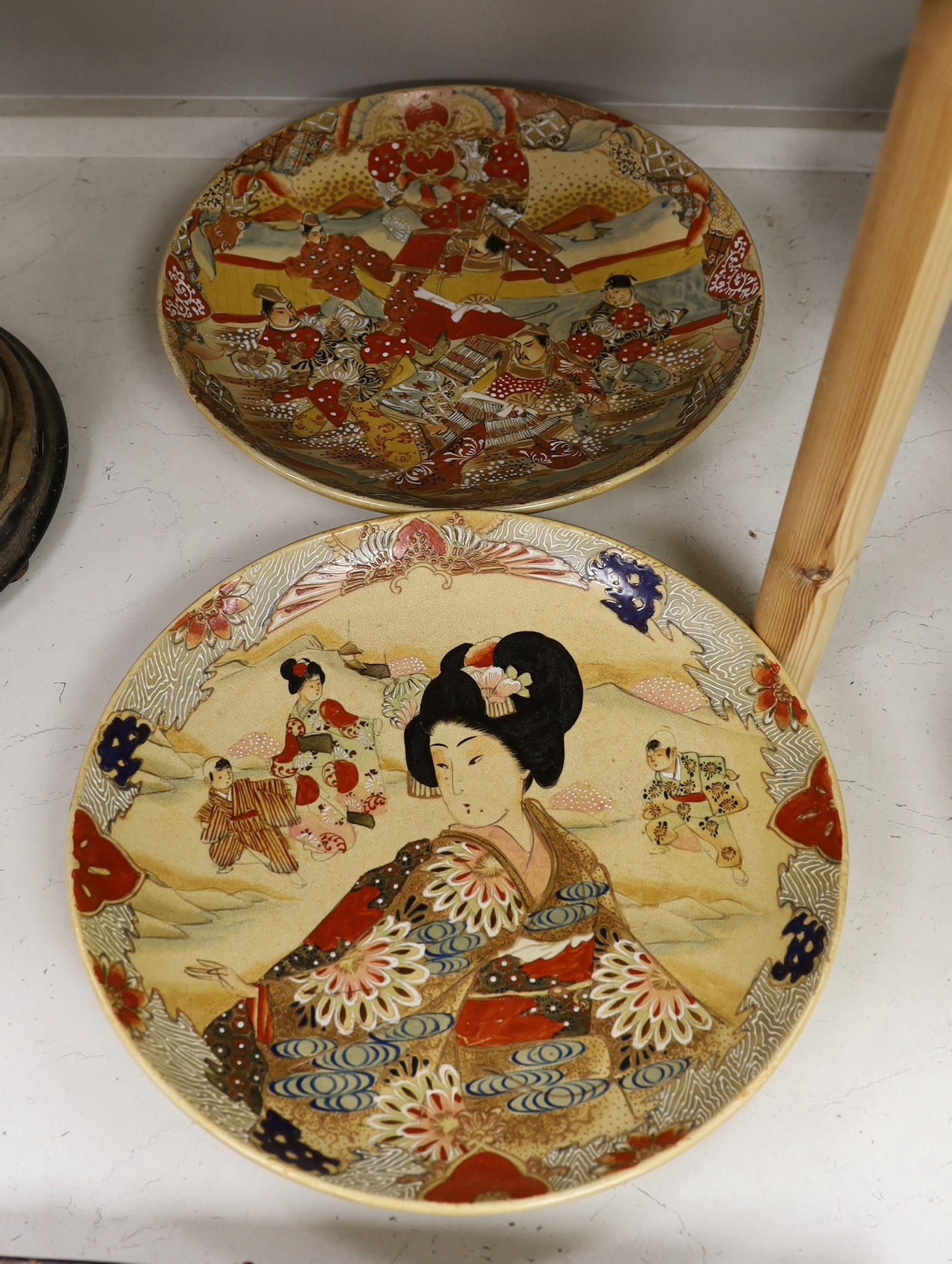 Two Japanese Satsuma pottery chargers. Largest 37cm diameter                                                                                                                                                                
